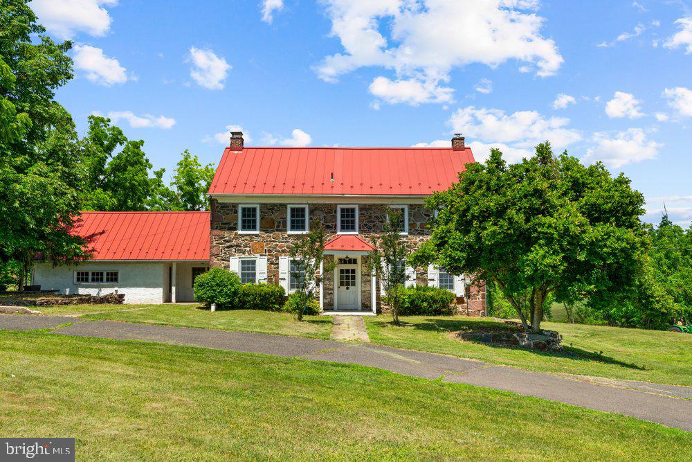 Overlooking the scenic fairways of Twin Ponds Golf Course, this extraordinary 10.55-acres  estate offers a rare combination of historic charm, equestrian amenities, agricultural versatility, and future potential. Comprised of two separately deeded parcels, the property presents a unique opportunity to own one of the area's most distinctive country estates.As you enter the property, sweeping views of Twin Ponds Golf Course immediately capture your attention. Rolling pasture, mature trees, wooded walking trails, and open countryside create a setting that feels worlds away while remaining conveniently located near major commuter routes, shopping, dining, and everyday conveniences.At the heart of the estate stands a historic stone farmhouse dating back to the 1800s, offering over 3,000 square feet of living space, four bedrooms, two-and-a-half baths, three fireplaces, and the timeless character only a home of this era can provide. A swimming pool complements the outdoor lifestyle and provides the perfect place to relax while enjoying the surrounding landscape.Equestrian enthusiasts will appreciate the established 8-stall barn, ready for immediate use, along with direct access to riding trails throughout the property. The thoughtful placement of the barn creates separation between the residence and equestrian facilities, allowing for both functionality and privacy. Open pasture areas, wooded sections, and agricultural land provide flexibility for horses, farm animals, hobby farming, recreation, or future agricultural pursuits.Currently benefiting from Act 319 agricultural designation, the property offers the appeal of a working farm while also presenting potential future opportunities for the next owner to explore. Whether envisioned as a private equestrian retreat, gentleman's farm, multi-generational family estate, or long-term land investment, this exceptional property offers a combination of acreage, views, history, and versatility rarely found in today's market.Rarely does an opportunity arise to own over 10.55 acres overlooking a golf course with a historic stone residence, established equestrian facilities, farm potential, and two separately deeded parcels. This is more than a home—it is a legacy estate ready to be enjoyed for generations to come.