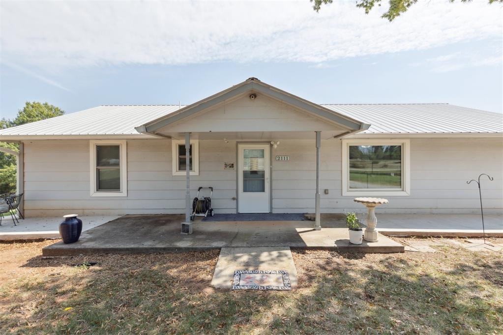 Don't miss out on this peaceful cottage tucked away on 3.34 acres. The home consists of 3 beds/2 baths. 40x30 detached garage/shop and a 30x12 covered space behind the garage. 2 storage buildings and an In ground storm shelter. Hand laid Australian Cypress flooring in the Living Rm, with a fireplace mantle made of Bubinga wood, imported from Africa. 2 - 500 gallon propane tanks. inside and outside camera system. This property has so much to offer. Schedule your appointment today.