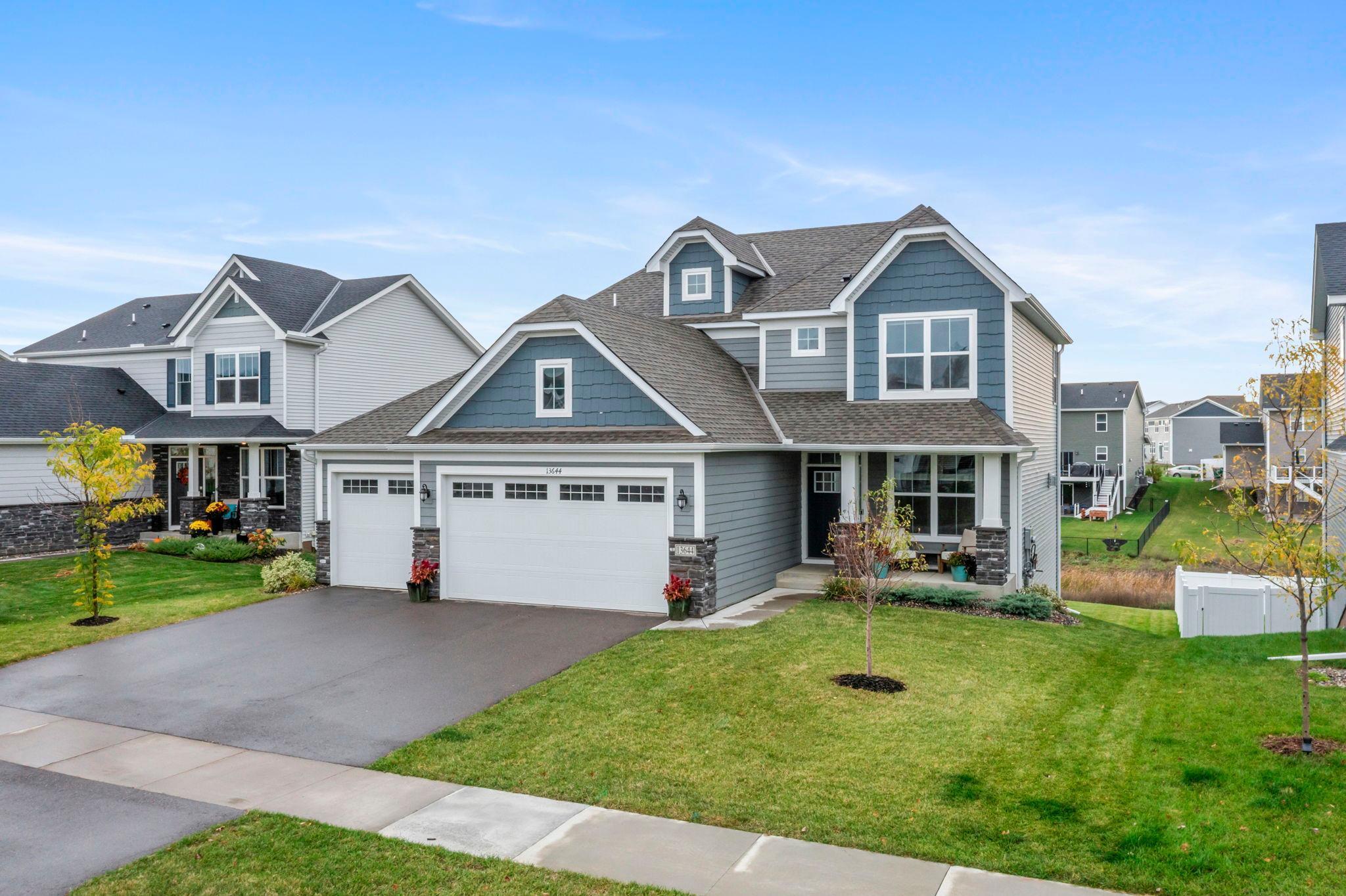 Welcome to this stunning four-bedroom, three-bathroom Lennar home in the highly sought-after Edgewater community. Built in 2023 near the Mississippi River, enjoy easy access to scenic trails, parks, shopping, and dining. The bright, open main level features luxury plank flooring, a front office with French doors, a spacious kitchen with stainless steel appliances, a large center island, and walk-in pantry, plus a cozy living room with a gas fireplace. Upstairs offers four generously sized bedrooms, including a luxurious primary suite with a walk-in closet and private bathroom. The upper-level laundry includes a washer and dryer. The partially finished walkout lower level with new carpet is perfect for future living space. Three-car garage. A must-see!