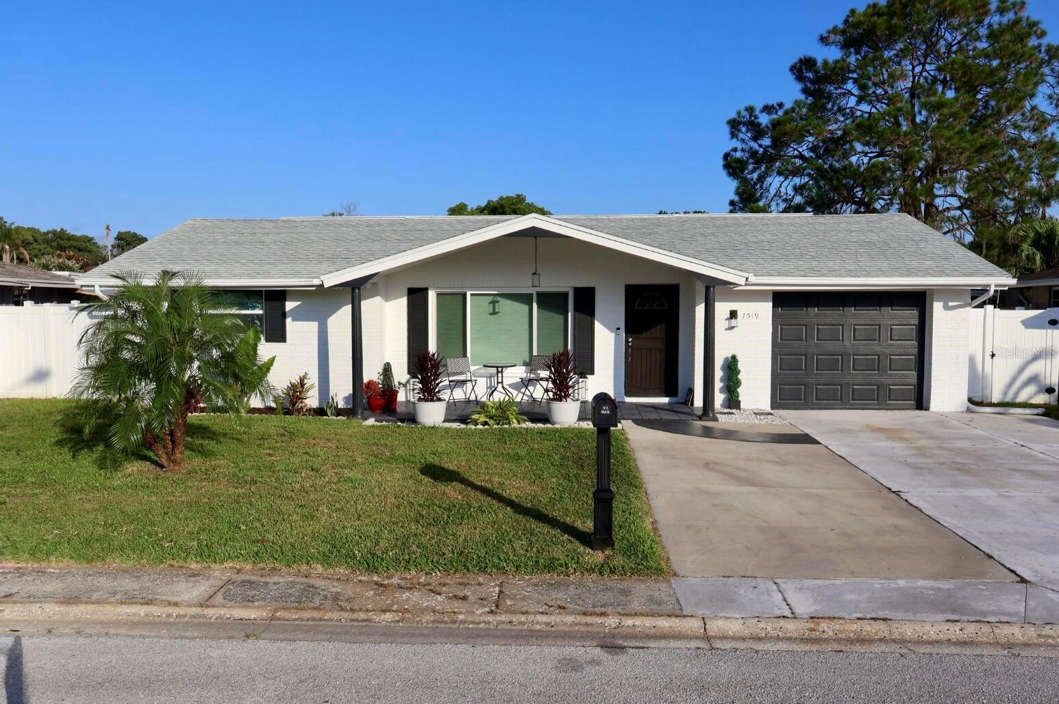 Charming Renovated Retreat Minutes from Downtown New Port Richey!Welcome home to this beautifully renovated 3-bedroom, 2-bathroom gem, filled with natural light and packed with lots of upgrades. Hurricane windows and a hurricane slider provide storm protection and energy efficiency, while the updated kitchen shines with elegant granite countertops. The enclosed Florida room is nice extra living space to make your own, wrapped in windows for sunlight and a nice view for backyard sunsets.This home also features a whole-house water softener plus a reverse osmosis filtration system at the kitchen sink for crisp, great-tasting drinking water. Brand new Trane AC system with advanced filtration built-in, all new ductwork and vents and no more having to buy filters. Brand new water heater too. The roof is only 6 years old, so you can move in worry-free.Step outside to your own private oasis: a spacious, fully fenced backyard featuring a concrete patio pad and charming pergola, great for entertaining friends and family. Unwind in the hot tub under the covered lanai, and enjoy the extra storage space provided by the 8x9 shed.Ideally located just 5 minutes from downtown New Port Richey's Main Street, you'll have easy access to popular restaurants, local shops, and entertainment near scenic Sims Park.