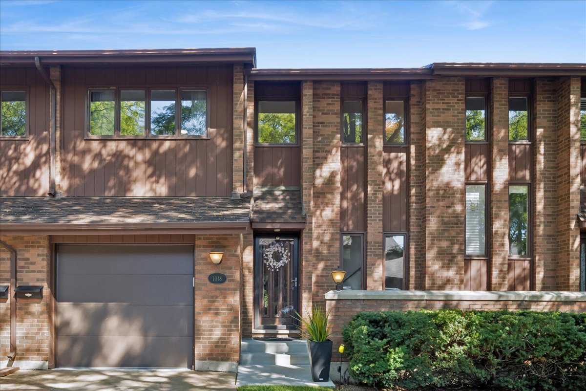 Maintenance free living in this 3 bedroom, 2.5-bath townhouse in the desirable Beau Ridge subdivision of Park Ridge. Excellent location close to restaurants, shopping, cafes, parks and public transportation.  Move right in to this beautiful townhouse that feels like a single family home.  Mature trees provide a sense of calm and privacy for the large back patio.  All landscaping, snow removal and other common area work maintained by the association, with one of the lowest monthly HOAs in Park Ridge. This updated unit features new hardwood floors on the second level and basement, with new tile entryway on the main level.  Updated kitchen features new appliances (2025), with a breakfast bar that flows into the dining room, with adjacent living room by a gas/wood burning fireplace.  Second level has three large bedrooms, a flexible loft/office space and two full bathrooms.  Master bedroom's updated en suite bathroom completed in 2024. Entertainment ready basement features custom-built cabinets and beverage fridge (2025), separate laundry with new utility sink and storage room separate from main area means your items won't interfere with your fun, in addition to mirrored double closet to keep board games or exercise equipment tucked away.   Attached private garage has been equipped with electric vehicle charging capabilities, floors refinished with epoxy coating and new door.