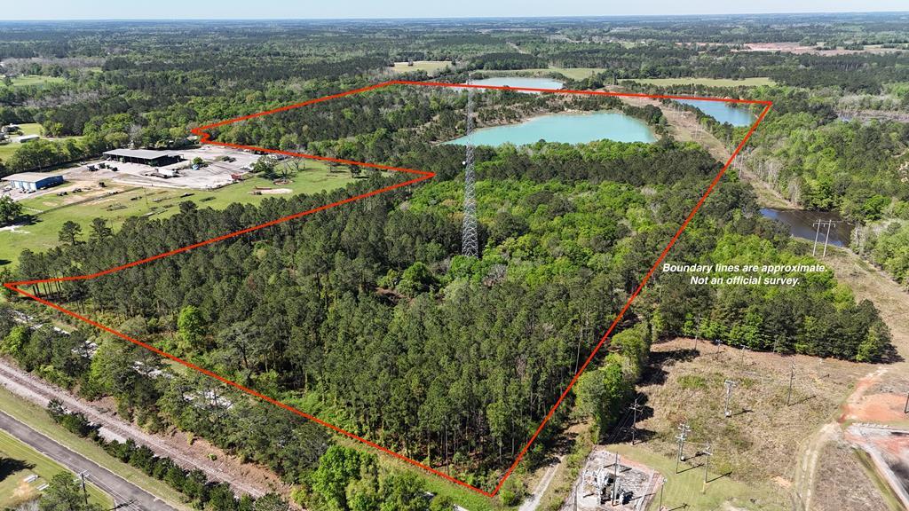 Check out this awesome 80+/- acre tract located in North West Thomas County just outside the city of Ochlocknee, GA! Featuring roughly 844+/- feet of paved road frontage on GA Hwy 3! This property has a mix of everything! Uplands, hardwoods, pines, lakes, etc. The soil was rich in minerals therefore some of the land has previously been mined. The result of the mining is a gorgeous 13+/- acre lake in the center of the property! There are two additional lakes near the property. Portions of the other two lakes are on the property. About 5+/- acres on the NW corner of the property, and about 1+/- acre on the SW corner of the property. These are truly magnificent lakes! Not to mention they would be extremely difficult, and costly to duplicate! Towards the front of the property there is roughly 0.60+/- acres that are designated as wetlands per the wetlands map. The remaining 60+/- acres of the property are all uplands. High, dry, and useable ground. There is some open land around the perimeters of the lakes. The rest of the land is heavily wooded with a mixture of hardwoods, and pines. There are numerous potential uses for this great property! This would make an amazing recreational tract! Stock the lake! Enjoy hunting, fishing, and ATV/UTV riding! Excellent whitetail deer, wild turkey, and small game hunting. I would imagine there are some decent waterfowl opportunities as well with the lakes. Use the property for agricultural purposes. Great potential for farming. Harvest the timber, and replant. This would also be a great location for a solar farm. There is a Georgia Power substation adjacent to the north property line. There is an electrical transmission line that runs along the north property line, and ultimately cuts through the NW corner of the property. There is a cell phone tower near the front of the property. The cell phone tower, and the cell phone tower contract do not convey with the sale. Ochlocknee, Thomasville, Moultrie, and Bainbridge are all nearby!