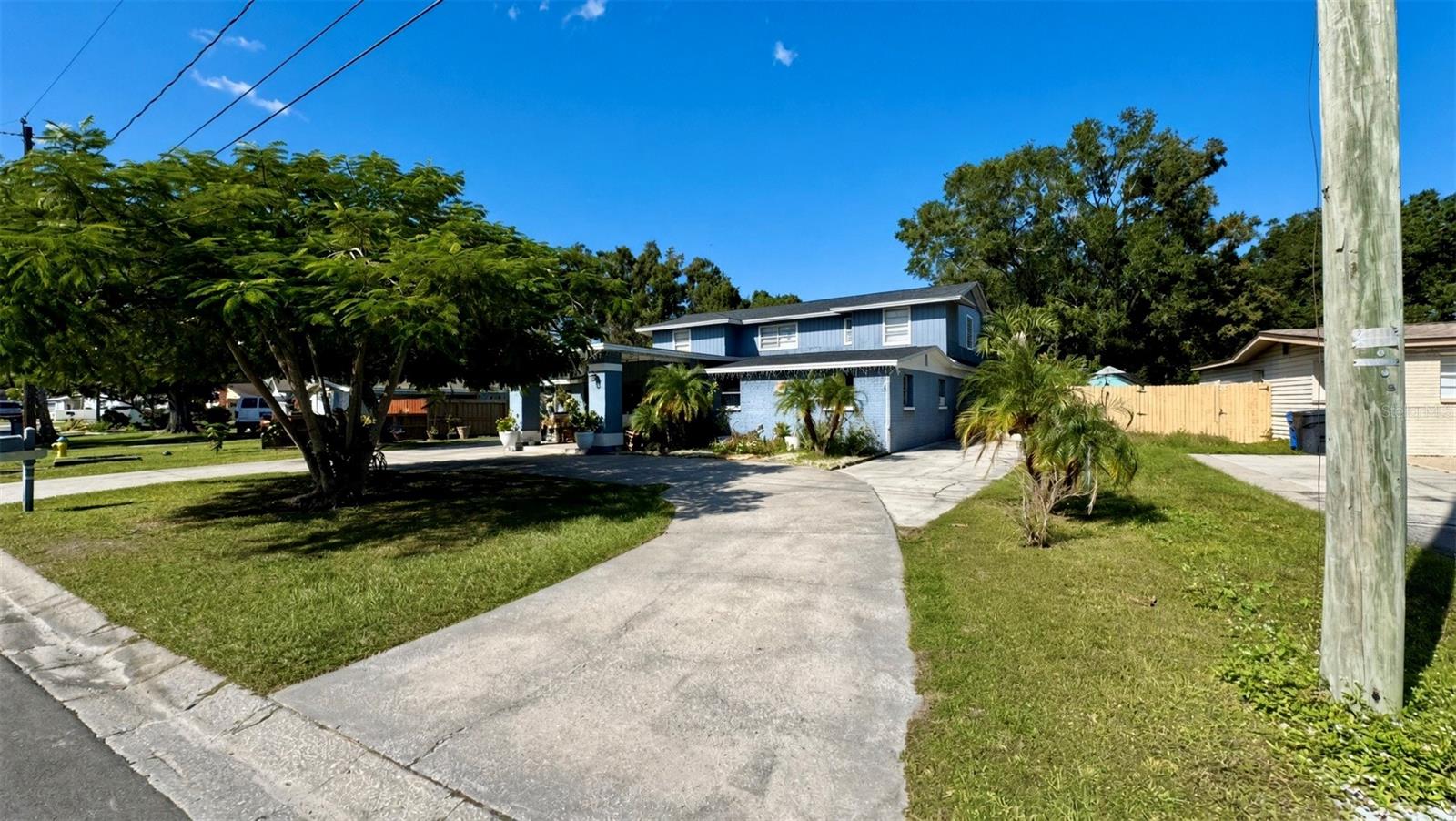 Discover the possibilities this homes has to offer!!!! This spacious and versatile property offers a unique layout with multiple living spaces, making it an excellent opportunity for a large household, multigenerational living, or buyers seeking flexibility. The main floor features 3 bedrooms and 2.5 bathrooms, plus 2 additional bonus rooms that can be used as bedrooms, a home office, or flex space to fit your needs. The second floor features a full apartment with 3 bedrooms, 1 bathroom, a living room, dining area, and a full kitchen, offering additional space for extended family or guests. Enjoy access to a nearby lake, adding to the property's appeal. Recent improvements include a new roof and a recently replaced HVAC system. Conveniently located just a short drive from Tampa International Airport and Downtown Tampa, with easy access to major roadways, shopping, dining, and entertainment. Enjoy nearby Al Lopez Park, Raymond James Stadium, Midtown Tampa, and the attractions of Downtown Tampa, including the Tampa Riverwalk, museums, waterfront parks, and restaurants. With generous living space, flexible room options, and a convenient location, this property offers an exciting opportunity to make it your own in Tampa!