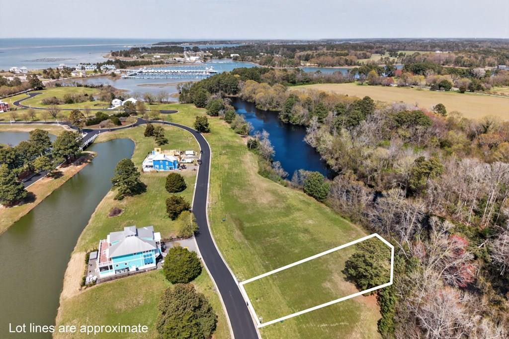 Homesite 32 in Marina Village East at Bay Creek is your opportunity to own a prime coastal property in a golf cart–friendly community. Ideally located near downtown Cape Charles, marinas, shopping, and dining, this homesite offers both convenience and charm. Enjoy Bay Creek's exceptional amenities, including a private 2-mile beach, nature preserve, pools, and more. There is no required timeframe to build, giving you flexibility to plan your dream home. Take advantage of Builders Guild recommendations to help simplify and streamline the building process. Now is the perfect time to secure your homesite in this fabulous coastal community!