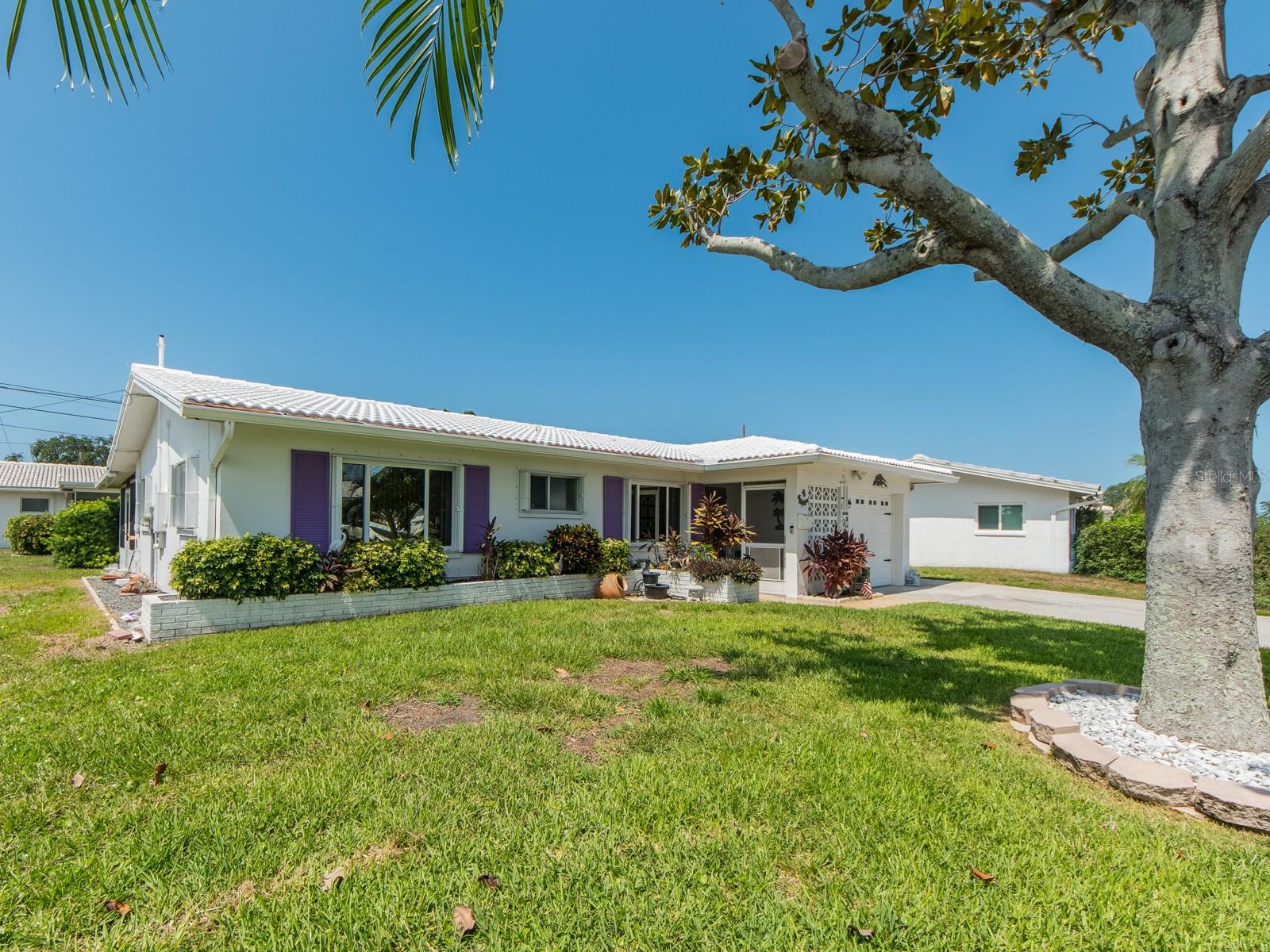 This lovely 2 bedroom, 2 bath, 1 car garage home in Tamarac is quite spacious with stainless steel appliances, solid surface countertops, you name it. Not in a flood zone and close to shopping, dining, Publix and more. The home is one of the larger ones in Tamarac with well manicured yards.  Our lawn crews are at Tamarac at least 2 days a week performing their landscaping tasks.  We also have a full tine maintenance man who is very dedicated to his work. Don't miss this great opportunity for a lovely home in a lovely neighborhood. A new roof will be ordered soon if it hasn't been already.