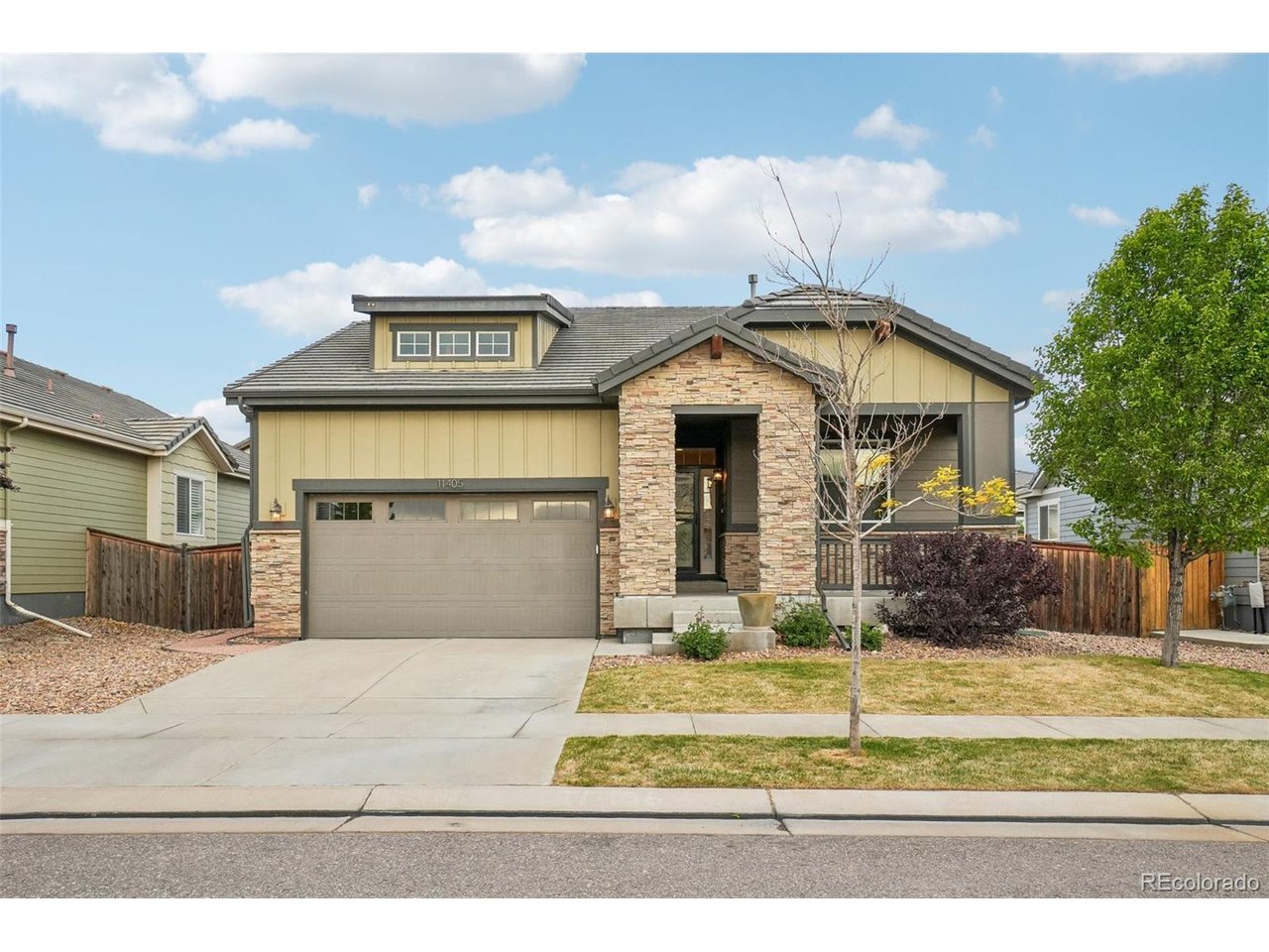 Located in the desirable Buffalo Run Golf Course community in the Villages at Buffalo Run, this beautifully designed ranch-style home built in 2017 offers an open-concept layout ideal for both everyday living and entertaining. Featuring three bedrooms, three bathrooms, plus a dedicated office/den, this home combines comfort, functionality, and style throughout.A welcoming foyer leads to a spacious secondary bedroom and nearby full bath, while elegant French doors open into the private office complete with custom floor-to-ceiling shelving. The heart of the home is the expansive kitchen with a large center island, generous cabinet space, walk-in pantry, and seamless flow into the dining and living areas. Large windows throughout the main level fill the home with abundant natural light.Privately situated at the rear of the home, the spacious primary suite offers a relaxing retreat with a luxurious en-suite bath featuring dual vanities and two oversized walk-in closets. The finished basement expands the living space with an additional bedroom, full bathroom, recreation area, and substantial unfinished storage space.Step outside to enjoy the oversized deck and beautifully landscaped low-maintenance yard accented with mature flowers and garden beds. Additional highlights include a security system, oversized two-car garage, fully fenced yard, and convenient access to the golf clubhouse and restaurant just a short walk away. Ideally located near major highways, Denver International Airport, and only about 20 minutes from downtown Denver. **Some photos have been virtually staged**