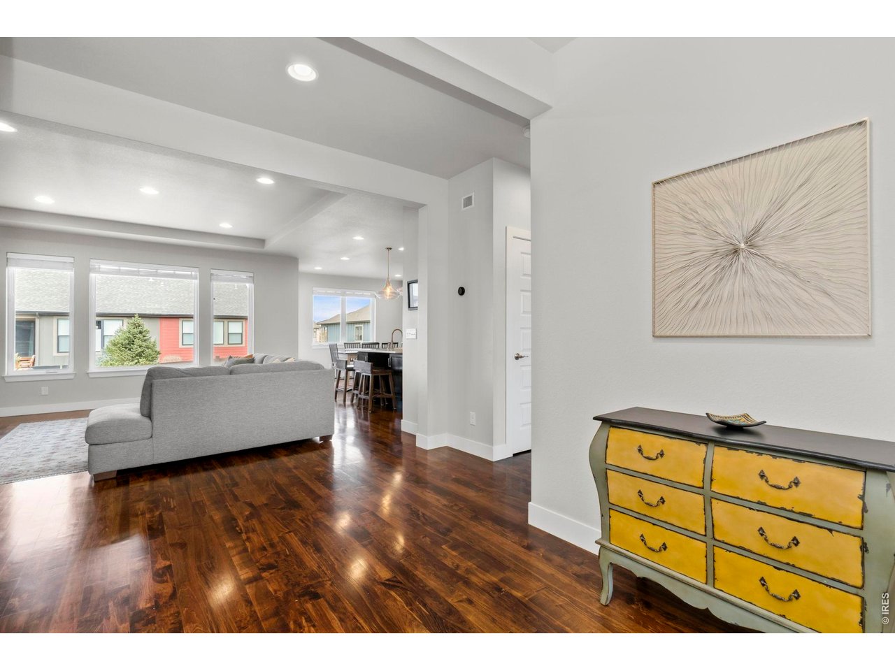 Modern farmhouse ranch patio home offering true lock and leave convenience in a highly desirable Timnath location. Built in 2018, this thoughtfully designed 4 bed, 3 bath residence blends elegant finishes with comfortable living across 3,078 sq ft (2,621 finished). Expansive windows invite natural light and create seamless indoor outdoor connection to the oversized covered patio and fully landscaped HOA maintained grounds. Gourmet kitchen showcases quartz countertops, large island with seating and storage, full tile backsplash, 42" cabinetry with crown molding, gas range with canopy hood, double ovens, and stainless appliances. Rich hardwood flooring anchors the main level great room featuring a corner brick gas fireplace. Spacious primary retreat offers tray ceiling, walk in closet, dual sink vanity, full tile shower, and private water closet. Finished basement provides generous family room, two bedrooms, 3/4 bath, plus storage. Enjoy mountain views, neighborhood trails, park, resort style pool, and Timnath Reservoir access.