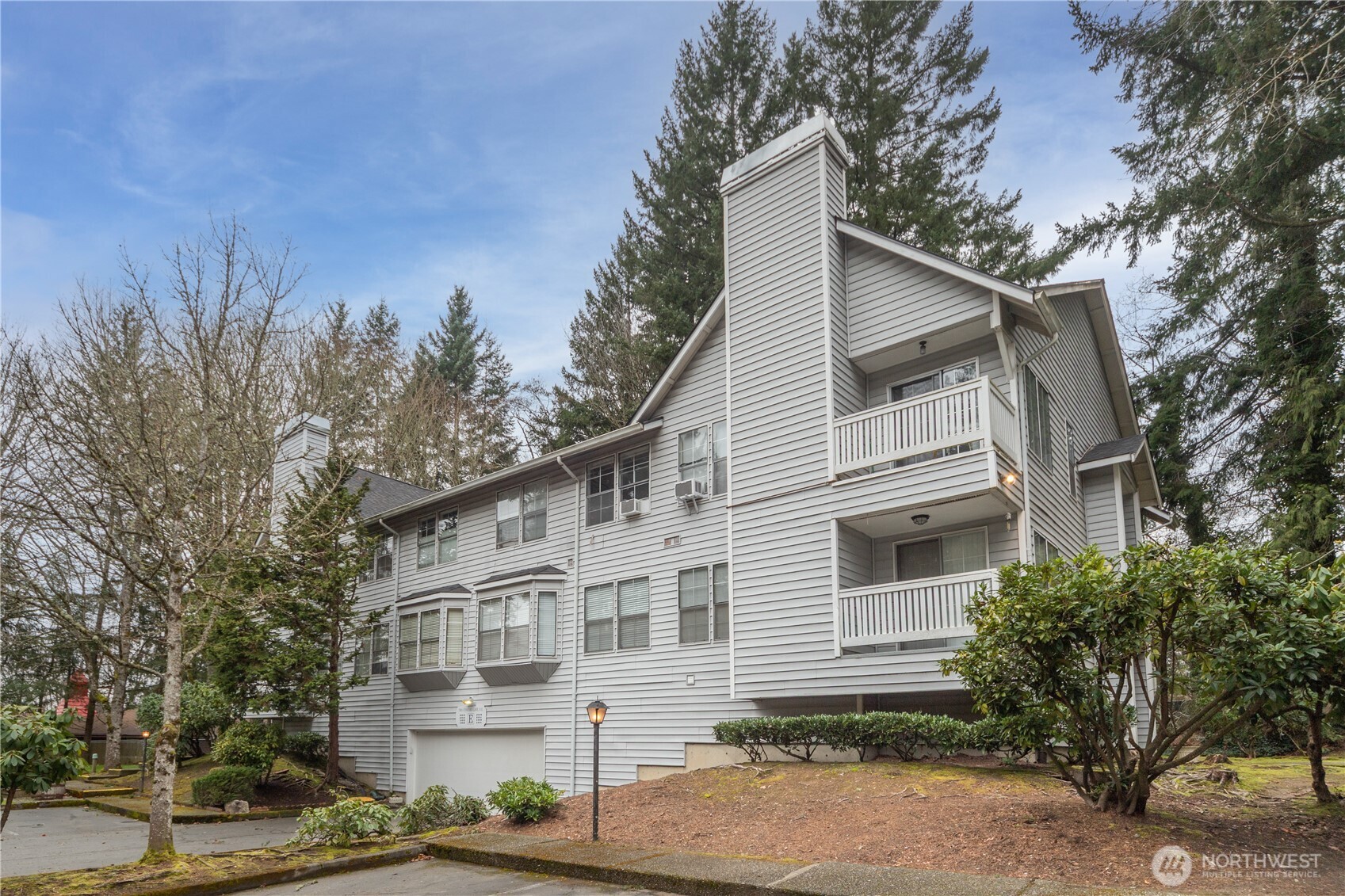 This beautifully maintained Washington Park condo offers a prime central location in Kitsap, just minutes from PSNS, Bangor Base, and only 10 minutes to St. Michael Medical Center. Thoughtfully designed with an open-concept floor plan, the home features an updated kitchen with quartz countertops and stainless steel appliances, a cozy fireplace, and abundant natural light that flows onto a private balcony—perfect for relaxing or entertaining. The spacious primary suite includes two generous closets, a private ensuite bath, and charming window seating. Additional highlights include secure garage parking with remote access and a large dedicated storage unit. Ideally situated across from Kitsap Tennis & Athletic Center, and close to daycare, bus lines, golf courses, shopping, and convenient access to WA-303. The well-maintained community grounds feature a charming gazebo and extra parking.