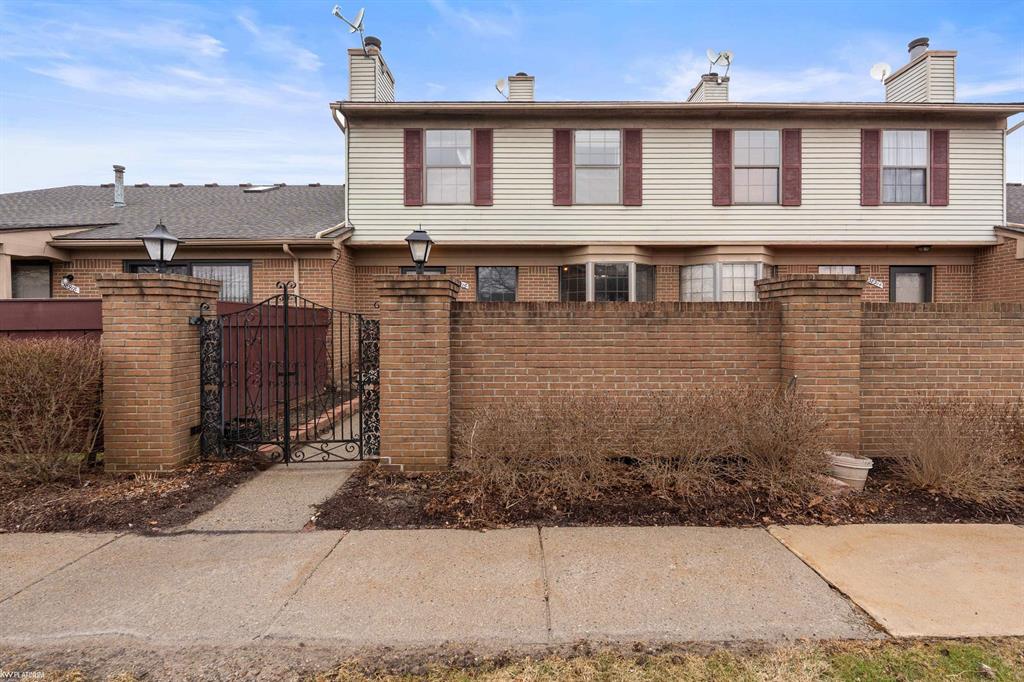 Charming 2-bedroom, 2-bath, two-story colonial condo tucked toward the back of the complex for added privacy and quiet surroundings. The main level features a comfortable living space with fireplace, flowing into the dining area and kitchen with ample cabinetry and counter space. Upstairs offers two spacious bedrooms and a full bath. The finished basement provides additional living space, perfect for a family room, home office, or recreation area. Enjoy a private fenced patio area ideal for relaxing or entertaining. Community amenities include a pool and tennis courts, offering resort-style living right in the neighborhood. Conveniently located near shopping, dining, and major roadways. Temporary additional $277 on HOA fee for new roofs for the complex.