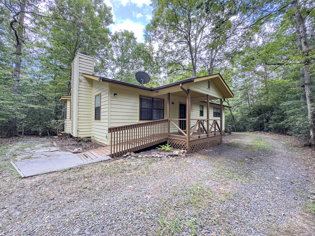 Gently rolling woods surround this 2 bedroom plus bonus room, 2 bath cabin with detached 1 car garage and private setting, no restrictions and easy access to both Murphy NC and Blairsville GA.  Truly a diamond in the rough.