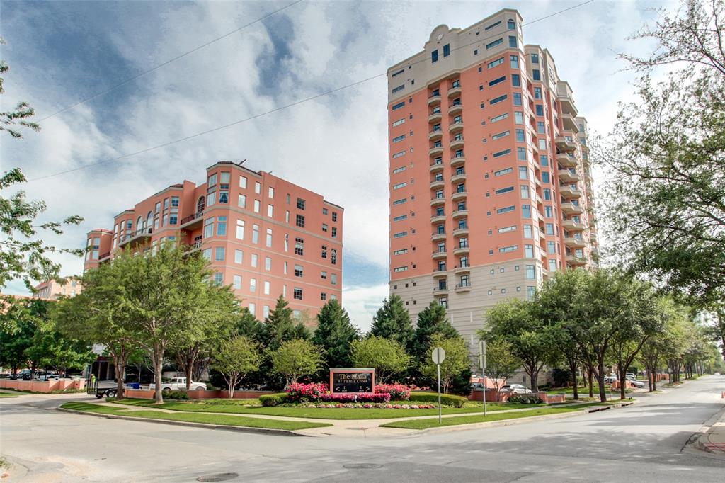 Experience sophisticated high-rise living in the heart of Turtle Creek at The Plaza. This elegant 5th-floor residence offers beautifully designed living space with two spacious split bedrooms, two & half baths, an expansive family room, formal dining area, and a richly appointed library-den featuring custom built-ins & a fireplace. Designed for both comfortable daily living & effortless entertainment. The gourmet kitchen showcases granite countertops, abundant custom cabinetry, a Sub-Zero refrigerator, Viking six-burner gas range & exceptional storage. Rich hardwood flooring flows throughout the main living areas. A private balcony off the family room provides a peaceful outdoor retreat with beautiful views of the city. The thoughtfully designed split-bedroom floor plan offers privacy for owners and guests alike, while generous room sizes and timeless finishes create an atmosphere of understated luxury. Residents enjoy an unparalleled lock-and-leave lifestyle with 24-hour concierge & valet services, a mediterranean resort-style pool, 2 fitness centers, elegant resident gathering spaces, beautifully landscaped gardens & two reserved garage parking spaces with an additional storage unit. Wonderful location is within walking distance of the Katy Trail, Turtle Creek Park, Uptown's acclaimed restaurants, boutique shopping, & vibrant entertainment venues and just minutes from Love Field, DFW Airport, the Medical District, & Downtown Dallas. This exceptional residence offers the perfect blend of luxury, convenience, & walkable urban living in one of Dallas' most prestigious neighborhoods.
