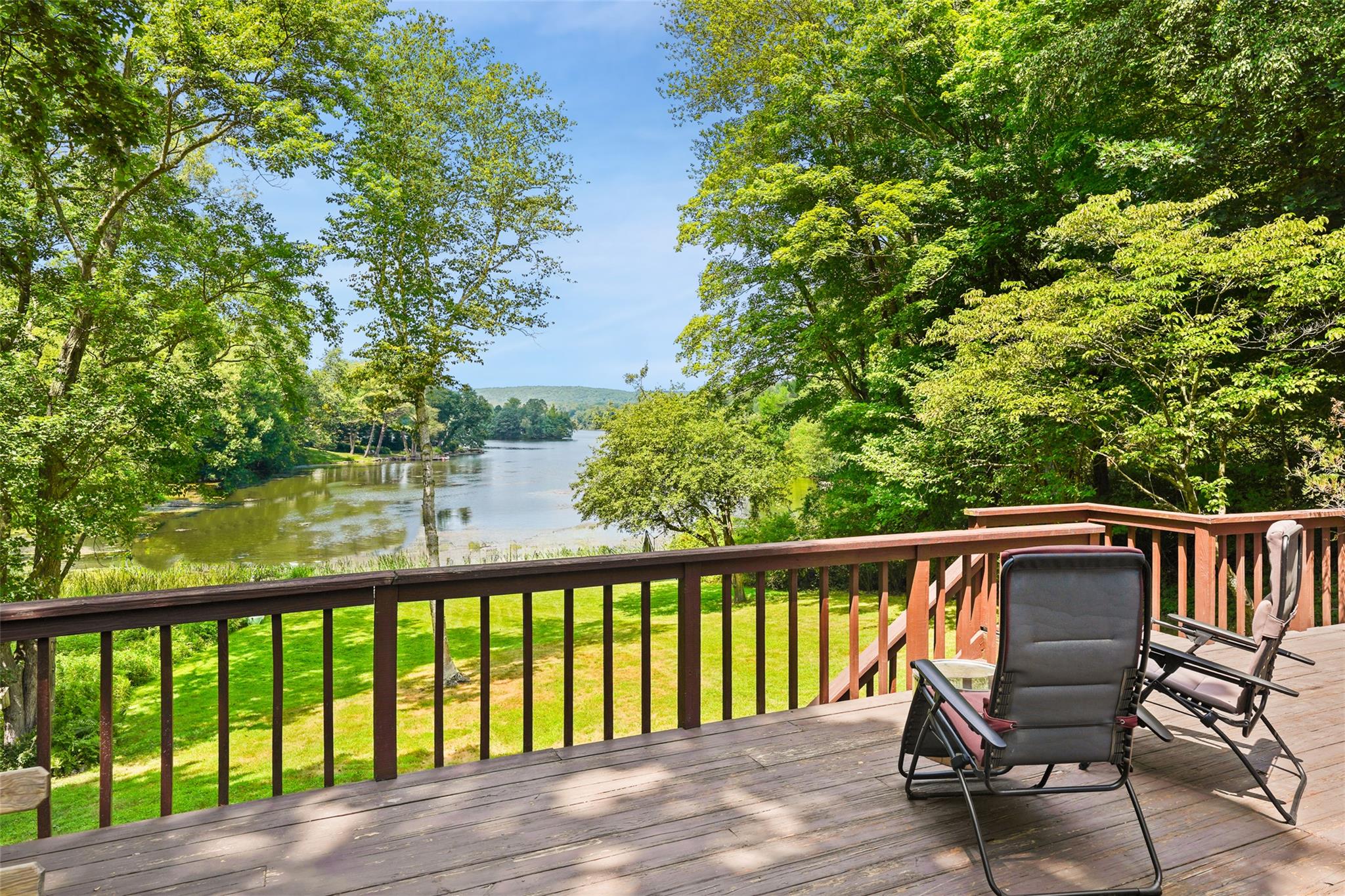 SPECTACULAR WATERFRONT. Positioned to capture light and views! Remarkable Country Lakehouse with a great open floorplan. Sun-drenched spaces with doors opening out to fabulous deck overlooking the lake. Stunning Great Room with stone fireplace and incredible water views. Perfectly updated Kitchen open to Dining Area also overlooking the water. Inviting Family Room with warm wood paneling, vaulted ceiling and fireplace. Two Bedrooms and a Guest Room/Office all with views of the lake. Lower Level Recreation Room with doors out to the lush, level lawn. The home features light wood floors throughout, updated kitchen and baths, an EV car charger and generator. Beautiful dock at the water’s edge by the nesting swans. Swim, boat and fish—a great lake lifestyle. Part of the award-winning Katonah-Lewisboro school district. A wonderful opportunity on Lake Truesdale for full-time living or a weekend/seasonal getaway.