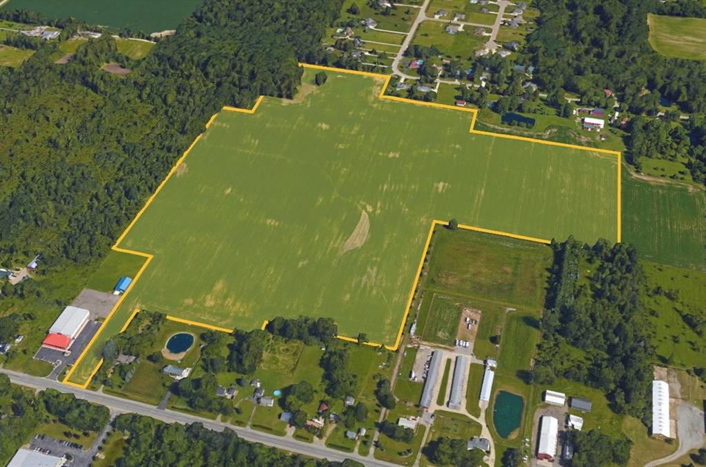 Opportunity Awaits!! ~72 acres, with access from Vienna Rd/M-57 and Field Rd. Ideal location for a condo or new housing development, or large commercial project. Public water and sanitary are available on M-57, as well as high speed internet, cable, and all other utilities.