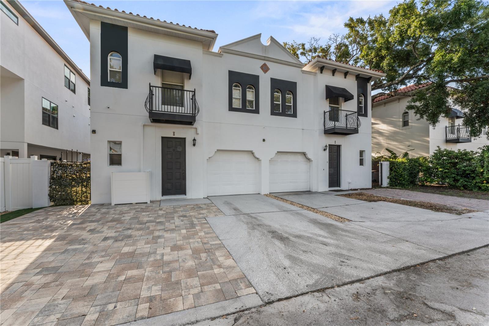 MUST SEE this absolutely beautiful totally updated townhome! Located in the very desirable area of Hyde Park/Soho this is one of the most walkable areas in all of Tampa offering numerous dining options plus 2 grocery stores all within a 5 minute walk.  This home features lovely “hardwood” luxury vinyl flooring throughout the entire home. The kitchen as been totally remodeled with new cabinets, quartz counters, a herringbone stone backsplash, all stainless steel appliances with a gas range plus a wine refrigerator and beverage refrigerator.  There is an inviting side yard located off the great room with Astroturf which makes a perfect spot for grilling outside.  The “wood” flooring continues up the staircase to the 3 bedrooms and 2 baths on the second floor.  The primary suite is absolutely stunning featuring an oversized bedroom that has been opened up to the bedroom next it for an easy to access office/den/nursery (can be easily closed back up), a perfectly built-out custom closet and a stunning all marble bathroom with a tub plus a separate glass enclosed shower. You will not be disappointed with this gorgeous townhome!