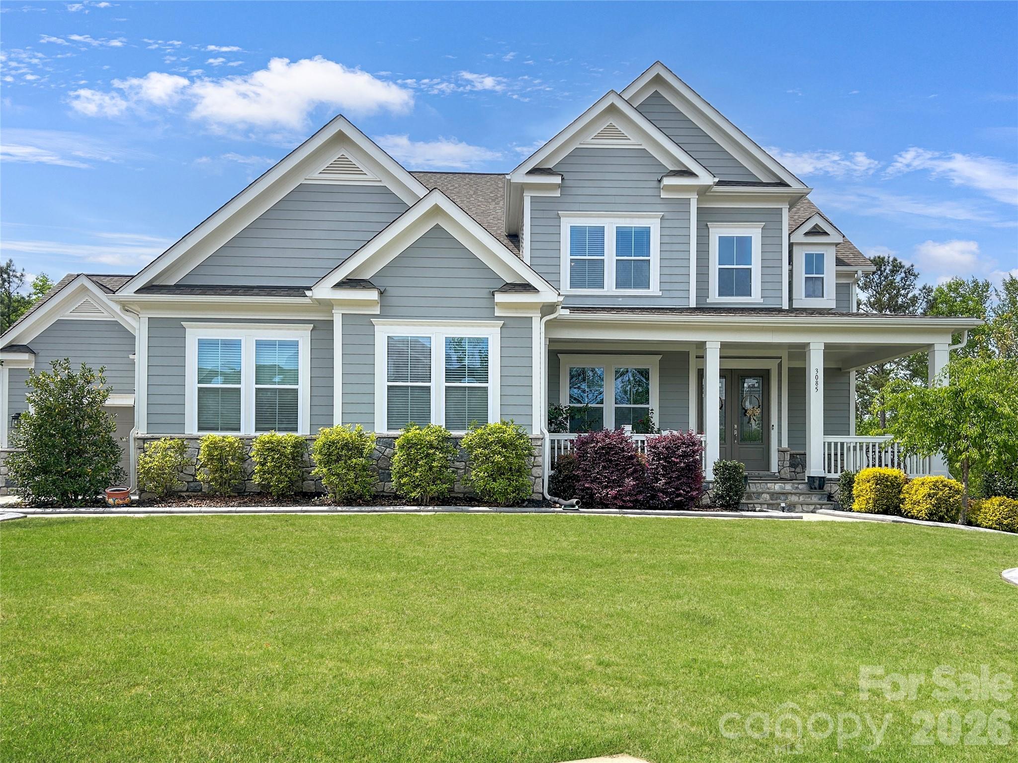 Welcome to Masons Bend — one of the area's most sought-after communities! This stunning 4-bedroom, 4.5-bath river front home is nestled on a quiet cul-de-sac lot and checks every box for the most discerning buyer.From the moment you step inside, you'll be greeted by real hardwood floors that flow throughout the main level. The living room is an absolute showstopper, featuring a beautiful stone fireplace flanked by built-in bench seats. Step through the double French doors leading to the rear composite porch, where a stone fireplace sets the scene for year-round outdoor entertaining.— the perfect gathering places for family and friends. The chef's kitchen is equally impressive, boasting a gas range with tile backsplash to the ceiling, double ovens, a large island with farmhouse sink, slow-close drawers and cabinets, and a large walk-in pantry to keep everything beautifully organized. A convenient drop zone keeps daily life running smoothly while on the way in or out of the 2 and 1 car garages. The main-level primary suite is a true retreat, complete with a spa-like bath featuring dual vanities, a soaking tub and separate large, glass and tile shower. Upstairs you'll find a spacious loft area along with three additional bedrooms and 2 baths, one being a Jack & Jill. Moving to the basement, you will find a fully built-out space that offers incredible flexibility — complete with a kitchenette, full bath with dual vanity and tile shower, dedicated flex room that can be used as a bedroom, gym space, a large living room and dining space along with abundant storage. The lower level walkout leads to a covered patio with a nicely equipped outdoor kitchen featuring a kettle-top charcoal grill and sink, all within a fully fenced yard.Additional highlights include a tankless water heater, whole-home water filtration system, smart thermostats, smart garage door openers, a high-capacity EV charger, and a laundry room with sink, cabinetry, full size refrigerator and a wine fridge. Termite bond conveys.The neighborhood features  Catawba River access, walking trails, a large clubhouse with event space, a gym, aerobics studio, 2 pools, firepit and playground. Award winning Fort Mill schools, low SC taxes and in neighborhood elementary school round it out. This home truly has it all — luxury, function, and an unbeatable location on the river. Schedule your private showing today before this one is gone!