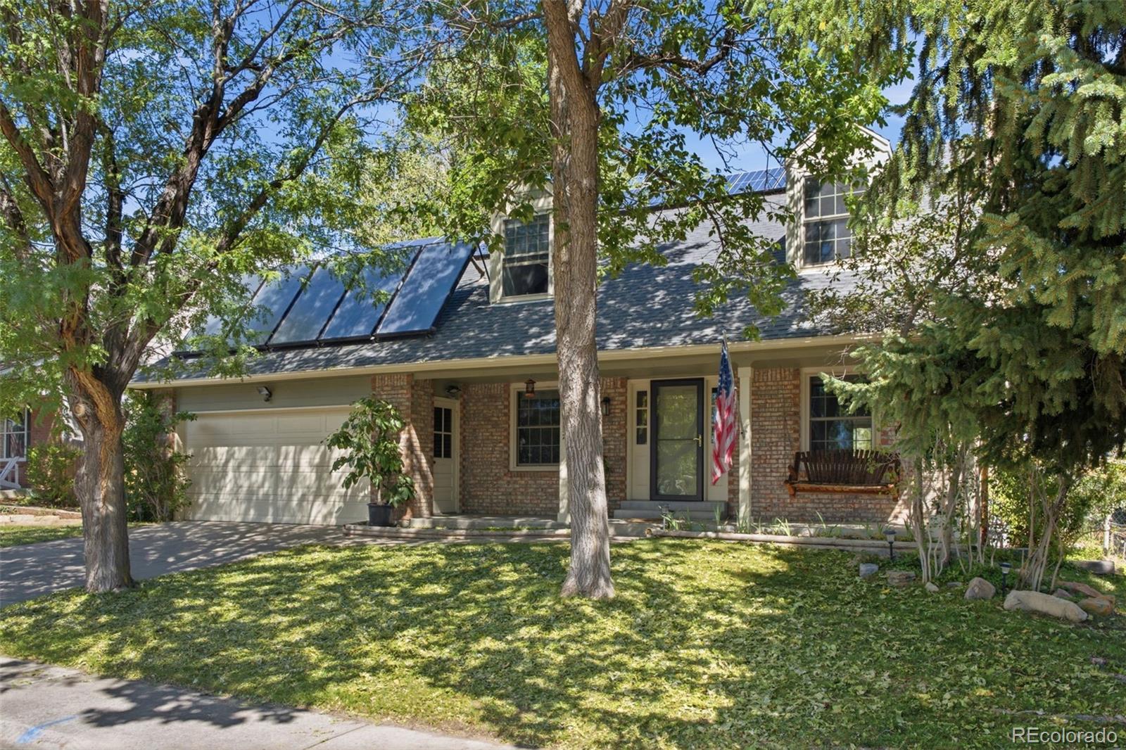 Inviting Two-Story Home in the Coveted Williamsburg Neighborhood! Fresh, Professionally Painted Interior & Exterior and New Carpet Make This Home Move-In Ready. The Main Floor Offers an Easy, Functional Flow with Flexible Living and Dining Spaces, Including a Cozy Wood-Burning Fireplace and Charming Bay Window off the Kitchen, Plus a Dedicated Office with French Doors and Convenient Half Bath. Updated Kitchen Features Granite Countertops, Gas Range and Stainless Steel Exhaust Hood. Bamboo Hardwood Flooring Flows Throughout the Main Level. Upstairs, Discover 4 Bedrooms Including a Spacious Primary Suite with Private Bath with Walk-In Shower & Heated Floor and Walk-In Closet Featuring Heated Floors and Private Balcony. Three Comfortable Secondary Bedrooms and an Updated Full Bath Complete the Upper Level. An Independent A/C System Located in the Attic Provides Dedicated Cooling for the Entire Upper Level. The Finished Basement Adds Valuable Living Space with Built-Ins, Laundry and Plenty of Storage. Step Outside to Enjoy a Large Deck with Solar Accent Lighting, Power Awning and Natural Gas Line for Grilling, Plus a Large Concrete Patio, Mature Landscaping, Garden Areas, Front and Back Sprinklers, Newer Backyard Fence, Garden Shed, Open Space Behind the Home and Spectacular Mountain Views from Both Upper and Lower Decks. Solar Panels and a 2-Car Garage Complete This Well-Cared-For Home in a Desirable, Established Neighborhood!Peace of Mind with Note Smart Home Updates Including: New Carpet on the 2nd Floor and Basement (2026), New Windows (2022 & 2026), Backyard Fence (2025), Garage Door Opener and Guest Bath (2024), Large Deck with Solar Accent Lighting and Power Awning (2023), Concrete Patio (2022), Primary Bath with Heated Floor (2020), Solar Electric (2016), Bamboo Hardwood, Powder Room and 95% Efficient Furnace (2013), Roof (2012), Primary Bedroom Deck (2008), Independent Upper Level A/C (2006) and Main Level A/C (2005). WELCOME HOME!