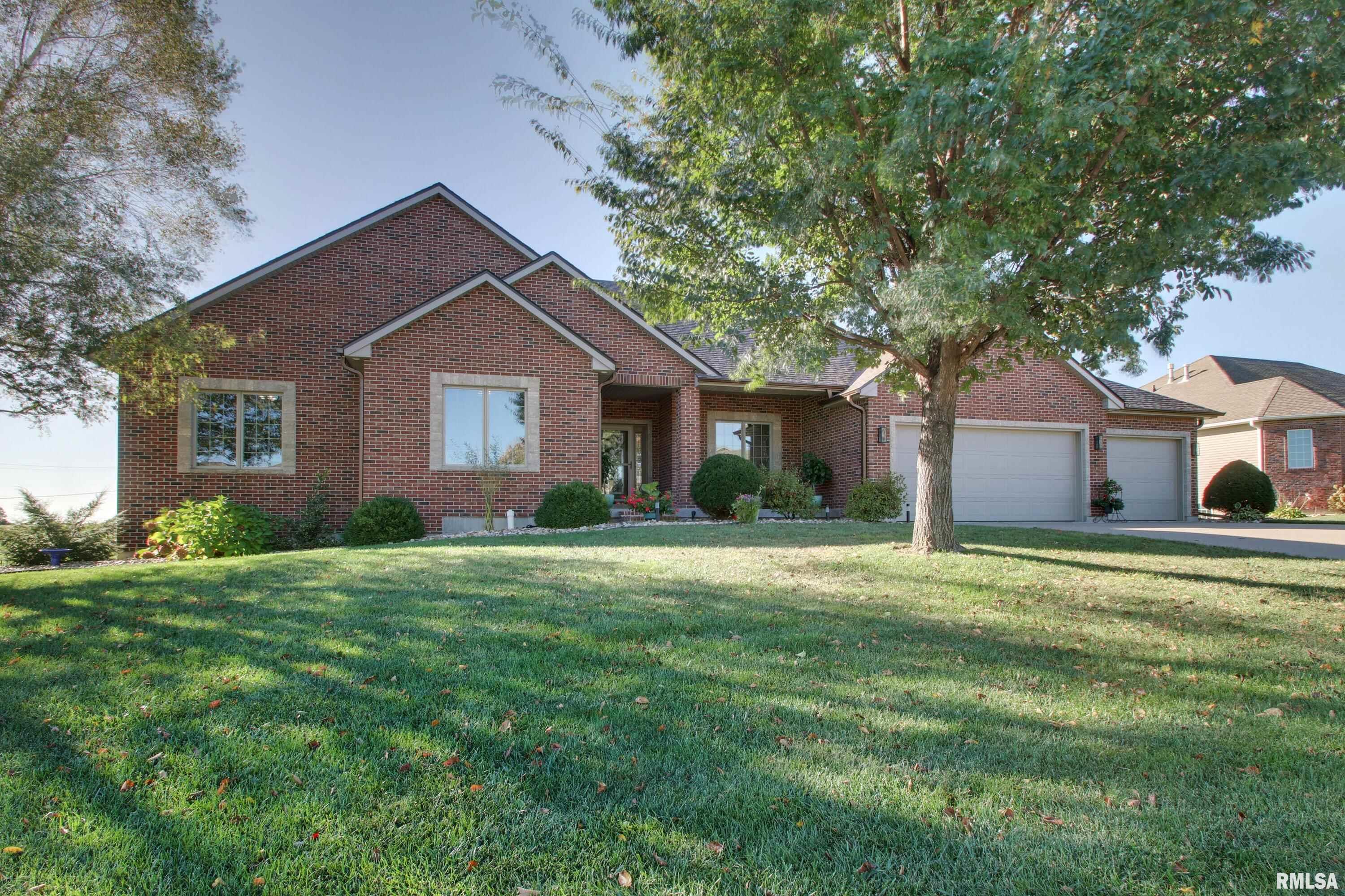 New roof and gutters. Total kitchen replacement 2024.New lighting in Kitchen, Dining and great room.  Laundry remodel in 2024. Heated garage. Lots of new landscaping. Large covered deck on rear of home and covered front porch. Back yard is fenced and overlooks a small lake. The basement is a full walkout and has a large amount of storage area.