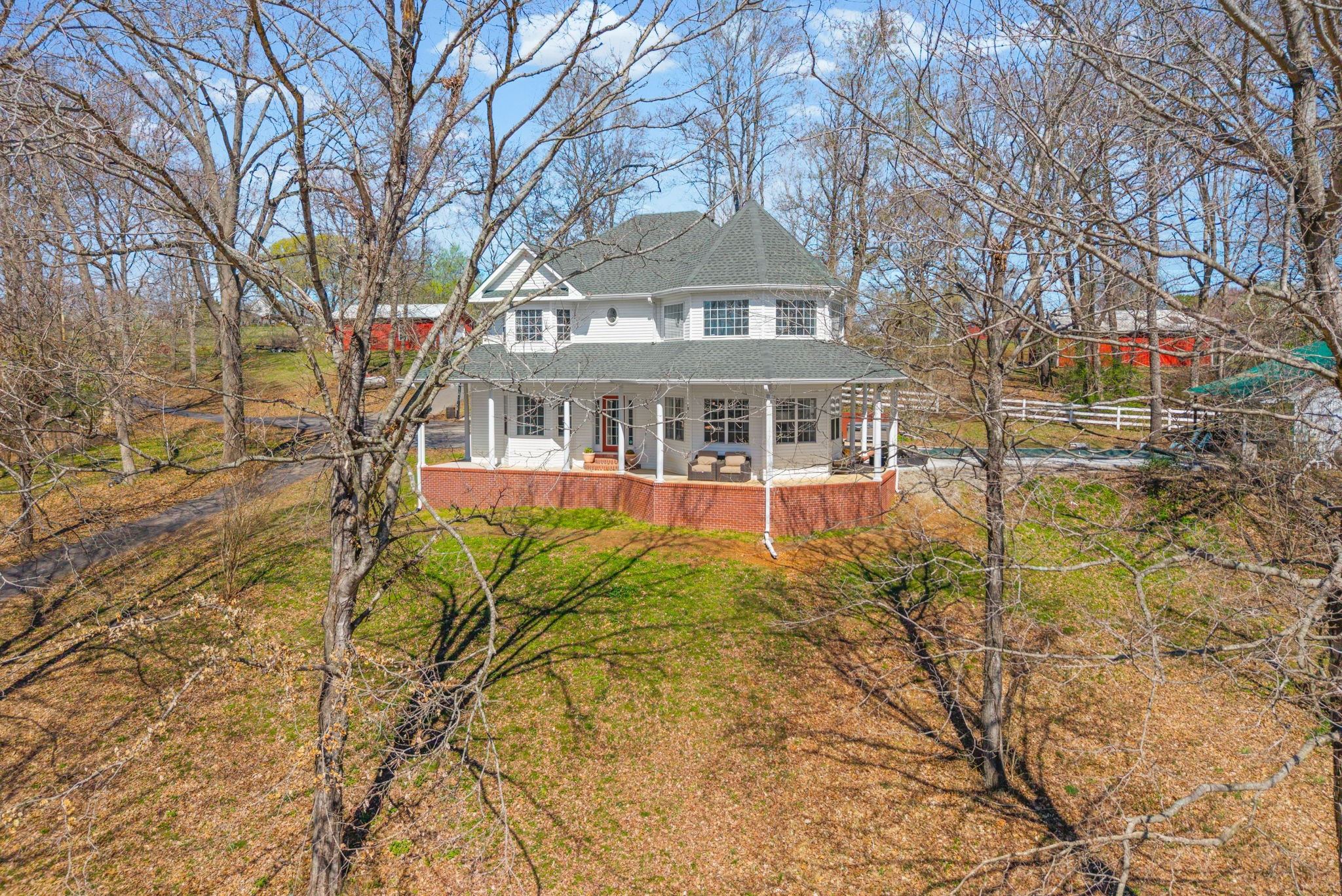 Welcome home to your private farmhouse retreat! Situated on just over 10 acres, this beautiful 3-bedroom, 2.5-bath home also includes a 828 sq. ft. 1-bedroom, 1-bath GUEST HOUSE—perfect for guests and extended family. Inside the main home, you'll find a warm and inviting living space with a gas log fireplace and a spacious, thoughtfully designed kitchen ideal for gathering and entertaining. The home features a blend of carpet, hardwood, and tile flooring throughout. The primary suite offers a relaxing escape with a garden tub, custom his-and-hers tile shower with dual showerheads, and double vanities. Step outside and enjoy everything this property has to offer, including an in-ground pool, a 40x30 shop, and a 35x40 barn—perfect for hobbies, storage, or animals. Two established pastures are already in place for horses, with plenty of additional acreage available to expand. Whether you're looking for space to spread out, room for animals, or the perfect place to entertain family and friends, this property offers the best of country living with endless possibilities.