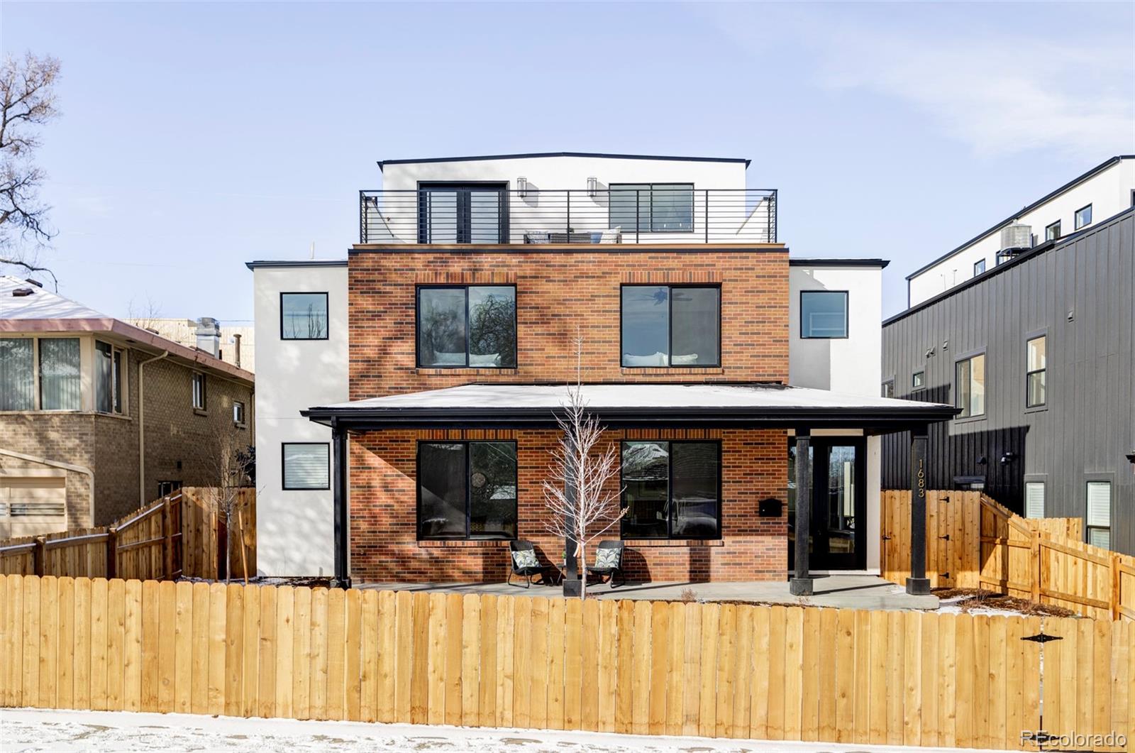 Introducing the gem of Sloan's Lake, 1683 N Zenobia! This brand new custom home features 6 above grade bedrooms and bathrooms, an office, a rooftop deck with wonderful views of the Sloan's Lake, and an extremely rare 4 car garage! The oversized chef's kitchen includes separate GE Monogram refrigerator and freezer, 48" JennAir dual fuel range with double ovens, JennAir MW over oven, 2 Bosch dishwashers, 2 sinks and a walk-in pantry. This beautiful kitchen opens to the oversized living room that features a gas fireplace with a fluted wood surround. On the main floor, you'll also find a beautifully designed office with the same fluted wood trim, and an en-suite bedroom that could serve perfectly as a live-in "mother in-law" suite. Upstairs you'll find the luxurious primary suite, comprising 2 walk-in closets and an upscale 5 piece bathroom featuring a soaker tub and dual rain head shower! The same floor enjoys 3 secondary bedrooms, and the laundry room. Venture to the 3rd floor to truly be blown away by the unparalleled bonus room with gorgeous views of Sloan's Lake, a wet bar, the incredible roof top deck, the 6th bedroom and another full bathroom. The generous backyard is anchored by a large covered porch, and a built-in gas grill with custom built brick surround. The 4-car garage has plenty of room for your Colorado toys and cars! Every inch of this custom home has been thoughtfully designed and constructed. Call today to schedule your showing!