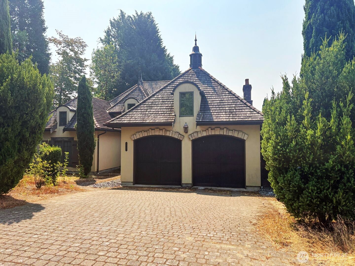 This gorgeous home sits at the high point of Renton's Stewart's Highland — Mediterranean rooflines, a private courtyard, and 2,890 square feet built to feel like a retreat five minutes from everything. Walk in and the kitchen does the talking: a gourmet layout, quartz counters, and vaulted ceilings pulling your eye through the great room. European-inspired finishes carry through every room — down to details most builders skip, including bidets in both full baths. The primary suite is its own wing, and a flexible room off the entry works as a home office or a fourth bedroom, whichever your life needs right now. Outside, it's built for real living: a covered patio, an outdoor kitchen, a fully fenced yard, and views that explain the price the moment you're standing in it. Stewart's Highland is a walk-everywhere neighborhood — shopping, dining, schools, and transit all in reach, with parks and trails close by and an easy commute either direction. For Renton homes for sale in this range, few match this mix of privacy and walkability. Move-up buyers, downsizers, remote workers — this Mediterranean-style Renton property works for all of them. Come see it before someone else calls it home first. (Note: Some photos contain Virtual Staging).