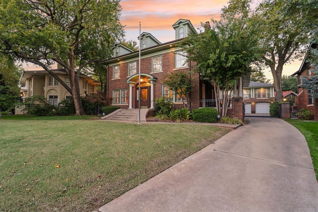 Built in 1925 and proudly featured on the 2012 Heritage Hills Home Tour, this historically designated Colonial-style residence embodies classic charm and enduring sophistication. Perfectly positioned across from the picturesque Harn Park, this home enjoys one of the most coveted locations in Harndale where only a handful of properties share the park setting and stunning downtown views. Step through the historic-style entry and be welcomed by original hardwood floors, soaring ceilings with elegant crown molding, and a beautifully crafted wood staircase. The main level offers both character and flexibility: a spacious living room with dual access Pella doors leading to an elevated covered side porch, cozy TV nook or library, a generous dining room, and a well-equipped kitchen. A mud bench and convenient half bath complete the first floor. Upstairs, you will find all three bedrooms. Two spacious bedrooms share a charming Jack-and-Jill bathroom, while the primary suite features dormer accent, walk-in closet and an expansive bath with a separate soaking tub and shower. The 182 sq ft third-floor flex space offers endless possibilities perfect for a playroom, office, or creative retreat. The 731 sq ft basement currently serves as a recreation area and laundry space, offering additional potential for customization. A rare three-car detached garage adds incredible value, complete with an 852 sq ft guest apartment not included in the square footage. This loft-style guest quarters showcases vaulted beam ceilings, a full kitchen, and private bathroom ideal for guests or studio space. Opportunities on this friendly, tree-lined street are few and far between. Enjoy the best of both worlds: the modern conveniences you love, surrounded by the rich character and community spirit that define historic Heritage Hills. With easy access to Midtown, Downtown, and Oklahoma City’s most iconic parks, dining, and cultural destinations, this home is truly one of a kind.