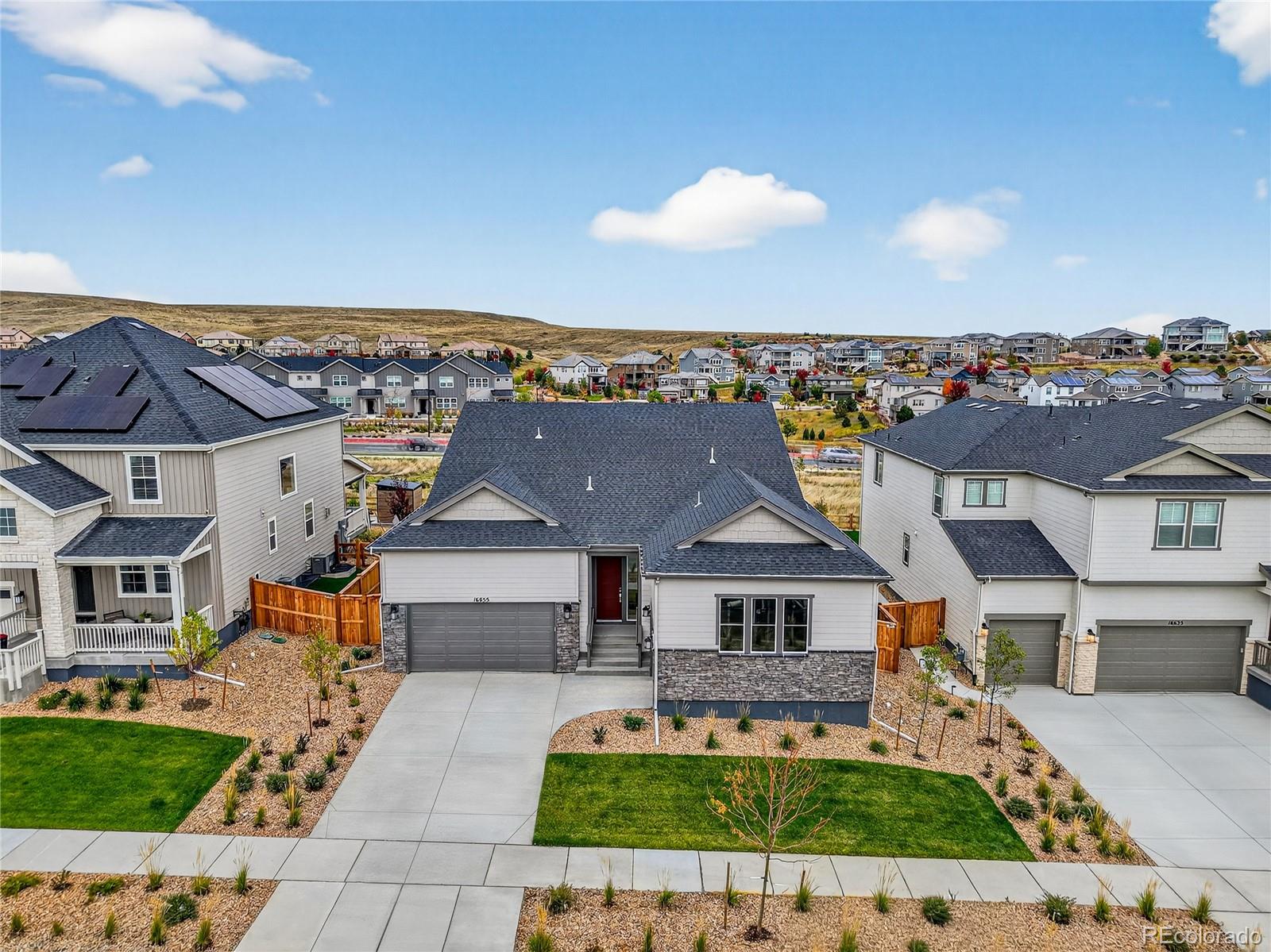 New Construction - Ready Now! Built by America's Most Trusted Homebuilder. Welcome to the Columbine at 16655 W 93rd Place in Trailstone. Experience effortless ranch-style living where luxury meets thoughtful design. From the impressive foyer, step into an expansive kitchen with a spacious eat-in island that flows seamlessly into the bright great room and dining area—perfect for entertaining. The sought-after split-bedroom layout provides privacy, with a welcoming guest suite and full bath near the front and a serene primary suite with a walk-in closet tucked at the back for a true retreat. Functional touches like a dedicated study and a large laundry room off the entry make everyday living a breeze. Structural options include: built in appliance package, primary bath configuration 5, covered outdoor living 1, center meet sliding glass door, traditional fireplace at great room, gas line rough in on patio, finished basement. MLS#9607996