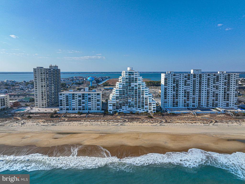 Welcome to your oceanfront escape in the iconic Pyramid building, where breathtaking views of the Atlantic Ocean set the stage for effortless coastal living. This 1-bedroom, 1 full and 1 half bath condo offers the perfect blend of comfort and opportunity, featuring updated flooring throughout and a spacious layout designed to maximize both relaxation and functionality.Start your mornings with coffee on your private oceanfront balcony, or unwind in the evening with dinner and drinks while listening to the waves and overlooking the outdoor pool below. The secure building offers peace of mind along with on-site management, making ownership easy and convenient.Ideally located within walking distance to popular restaurants, shopping, and entertainment, this property places you right in the heart of everything Ocean City has to offer.Thoughtfully priced to reflect both its prime location and the ability to personalize, this is a fantastic opportunity to add your own style and create the perfect beach retreat or investment property.Don’t miss your chance to own a piece of the oceanfront lifestyle.