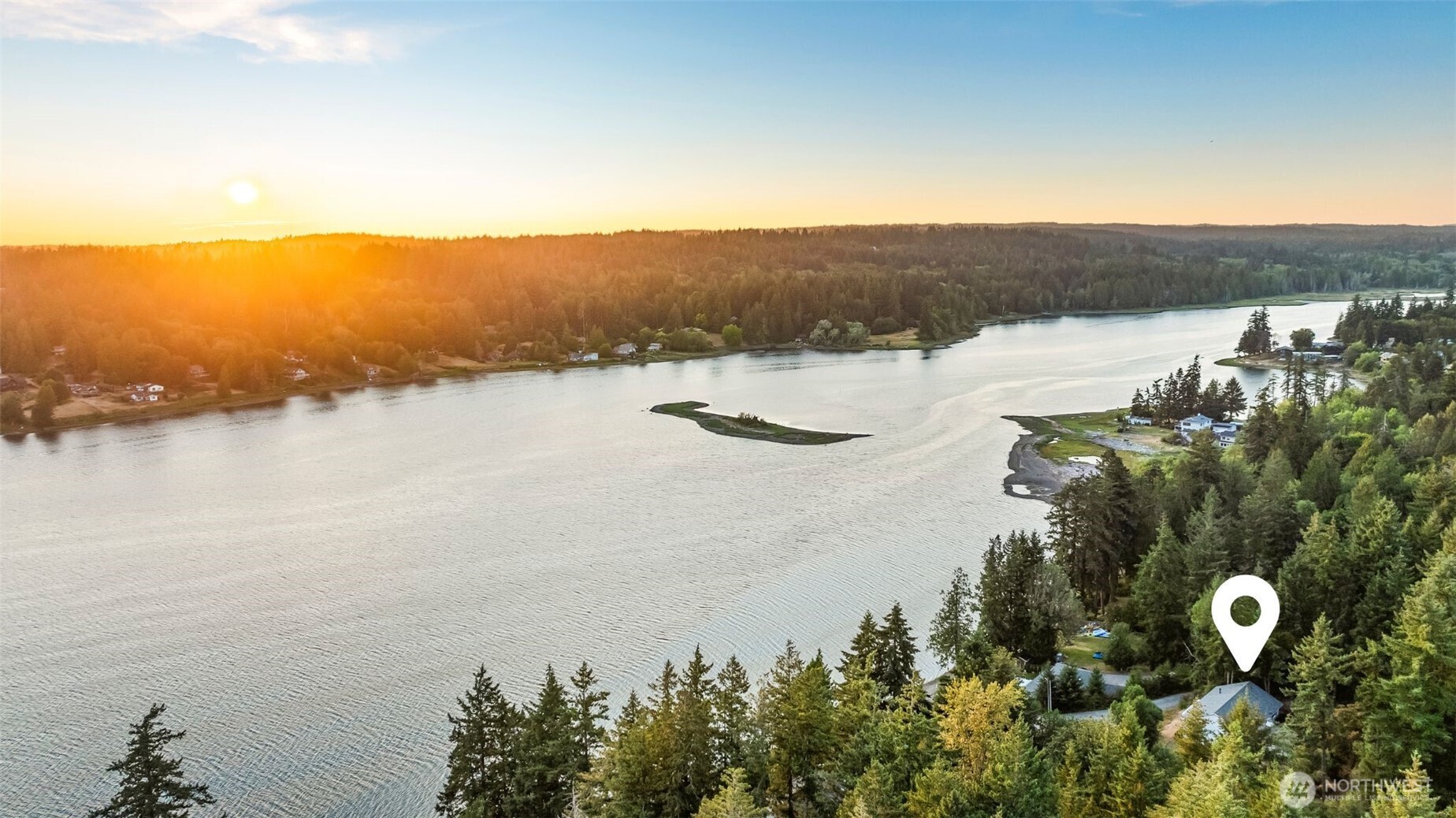 Gig Harbor water views for under $700K! This 3-bedroom, 2-bath home offers 1.18 acres of privacy, space to grow, and everyday convenience. Imagine waking up to peaceful views of Burley Lagoon and being minutes from Gig Harbor's amenities and waterfront charm. Inside you'll find vaulted ceilings and open living spaces. Enjoy evening sunsets in this light-filled single-level layout that opens to a balcony deck. Fresh Interior/Exterior paint and a newer roof (2022) check the big boxes. This is an incredible investment opportunity, w/room updates-Build instant equity! Park your RV/Boat, garden, or simply relax in your own retreat near Henderson Bay. The best of Gig Harbor living—water, woods, and potential—without the waterfront price tag.