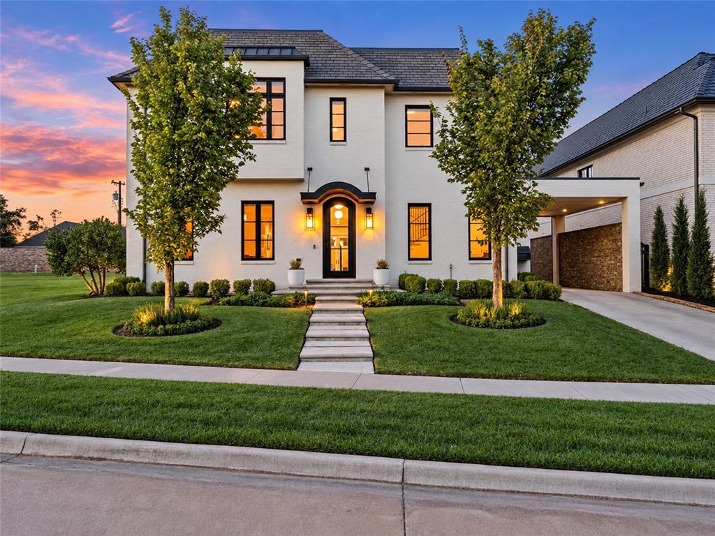 An exceptional expression of French Provincial architecture, this refined Nichols Hills residence is privately situated within the coveted Cumberland Court enclave. Encompassing 5,432 square feet, the home pairs timeless architectural character with sophisticated modern appointments, creating an atmosphere that is both elegant and effortlessly livable. From the moment of arrival, a gracious foyer introduces the residence with grand staircase, formal dining room, and expansive living spaces defined by natural light and beautiful finishes. Throughout, warm tones, tailored millwork, contemporary fixtures, and exceptional craftsmanship create a sense of understated luxury. At the center of the home, the kitchen is designed for both culinary excellence and gathering, featuring a Galley Workstation, Sub-Zero refrigerator, Wolf gas range, Asko dishwasher, and custom white oak cabinetry. Every element has been thoughtfully selected to balance performance with enduring aesthetic appeal. The primary suite is a private sanctuary, distinguished by its fireplace, French doors opening to the outdoors, and a beautifully appointed spa bath. Waterworks fixtures, a freestanding tub, generous walk-in shower, radiant heated floors, and an expansive closet with dedicated safe room. Designed with both everyday living and elevated entertaining in mind, the residence offers a versatile bonus/theater room, dedicated exercise area, Danby wine refrigerator, Lutron lighting controls, Sonos surround sound, comprehensive security and camera system, and EWS whole-home water filtration. Beautifully appointed and exceptionally maintained, this is a residence where classic European inspired architecture meets the comforts and sophistication of contemporary Nichols Hills living. An uncommon offering in one of Oklahoma City’s most distinguished neighborhoods. Guest bedrooms have been virtually staged.