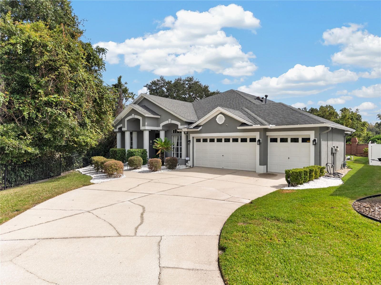 Welcome home to 18211 Wimbledon Green! This beautifully updated 4-bedroom, 3.5-bath pool home with a bonus room sits on a quiet cul-de-sac in Kingshyre, one of New Tampa’s most sought-after gated communities. With a low HOA and no CDD, it’s a rare find you’re going to love.From the moment you walk through the front door, you’ll feel right at home. Graceful curved archways draw you into the kitchen and family room, while the formal living room and dining area give you plenty of space to spread out, plus the perfect setting for holiday dinners, game nights, or a relaxed evening with friends.If you love to cook, get ready to fall in love with this kitchen. It’s been fully renovated with a 6-burner gas stove (2023) topped by a sleek stainless steel hood, a stainless steel dishwasher, and a wine fridge so your favorite bottle is always perfectly chilled. The showstopper is the huge center island, with storage on every side and enough space for every cooking project you can dream up. It’s also the natural spot where everyone gathers, whether you’re prepping a big meal or just catching up over coffee.Just off the kitchen, the family room overlooks your own private backyard oasis. The sparkling pool features a beautiful waterfall and a slide, so every day feels a little like vacation. Picture weekend pool days, morning coffee to the sound of the waterfall, and evenings outdoors soaking up the Florida sunshine. It’s the kind of backyard that makes hosting easy and staying in even better.The first-floor primary bedroom is a spacious, peaceful retreat with plantation shutters that let you control the light just the way you like it. Unwind in the primary bath, completely renovated in 2024, with a deep soaking tub and a walk-in shower. It’s your own personal spa at the end of every day.The remaining bedrooms are also on the main level, including a bedroom with its own en suite bath, plus an updated guest bath and a conveniently located laundry room. Head upstairs to the bonus room with its own half bath, a flexible space that works beautifully as a media room, home office, home gym, or private guest suite. The 3-car garage offers plenty of room for vehicles, storage, or a workshop.You can also relax knowing the big-ticket items have been taken care of: roof (2017), A/C (2017), water heater (2024), paint (2020), and pool pump (2022). That means more time enjoying your new home and less time worrying about what’s next on the to-do list.Location is everything, and this one checks every box. Behind the gates of Kingshyre, you’ll come home to a quiet, tucked-away street while staying close to everything New Tampa has to offer. Restaurants, coffee shops, grocery stores, and everyday errands along Bruce B. Downs Blvd are just minutes away, and the shops at Wiregrass and Tampa Premium Outlets are an easy drive. With convenient access to I-75 and I-275, getting to downtown Tampa, Tampa International Airport, USF, and the area’s major medical centers is a breeze. Highly rated Pride Elementary is nearby.Whether you’re relocating to the Tampa Bay area or simply looking for more room across town, this home is move-in ready and waiting to welcome you.Homes in Kingshyre with this combination of updates, space, and backyard fun don’t come along often. Come see it for yourself and fall in love with everything 18211 Wimbledon Green has to offer. Schedule your private showing today!