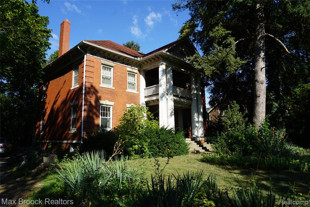 Historic Gem in West Pleasant Ridge - Rare Offering on expansive Corner Lot. A rare opportunity to own a piece of pleasant Ridge history. Nestled on a wooded, over 3/4-acre lot in highly desirable West Pleasant Ridge, this distinguished 1911 solid brick home offers nearly 3,000 sq.ft. of living space and is being offered for sale for only the second time since 1939. This 5-bedroom residence blends timeless architectural character with spacious living areas across three levels.The home features one full bath, one half bath, and one three-quarter bath, along with impressive 15' x 27' living room with fireplace, a formal 13' x 15' dining room, an a 11' x 11' office ideal for work or study. the heart of the home includes a kitchen with two pantries and abundant storage. elegant details throughout include solid oak trim, two sets of beveled-glass triple French doors, high ceilings, and numerous original windows that flood each room with natural light. Quality craftsmanship is evident in the home's hot water heating system with cast-iron radiators, copper water lines, PVC drains, and a dry full basement. Covered porches on both the main and second levels invite you to relax and enjoy the serene setting, while the huge attic provides endless storage. A rare bonus to this property is the steel-frame clear span garage, offering 1,500+sq. ft. on the main level plus approximately 1,000 sq. ft upstairs-perfect for housing up to five or more cars, hobbies, or workshop space. The home does require updating, including new roofs for both the house and garage, as well as a kitchen renovation, offering the next owner the chance to restore and customize this one-of-a-kind property. Showings are available by appointment only to pre-approved buyers only or proof of funds.