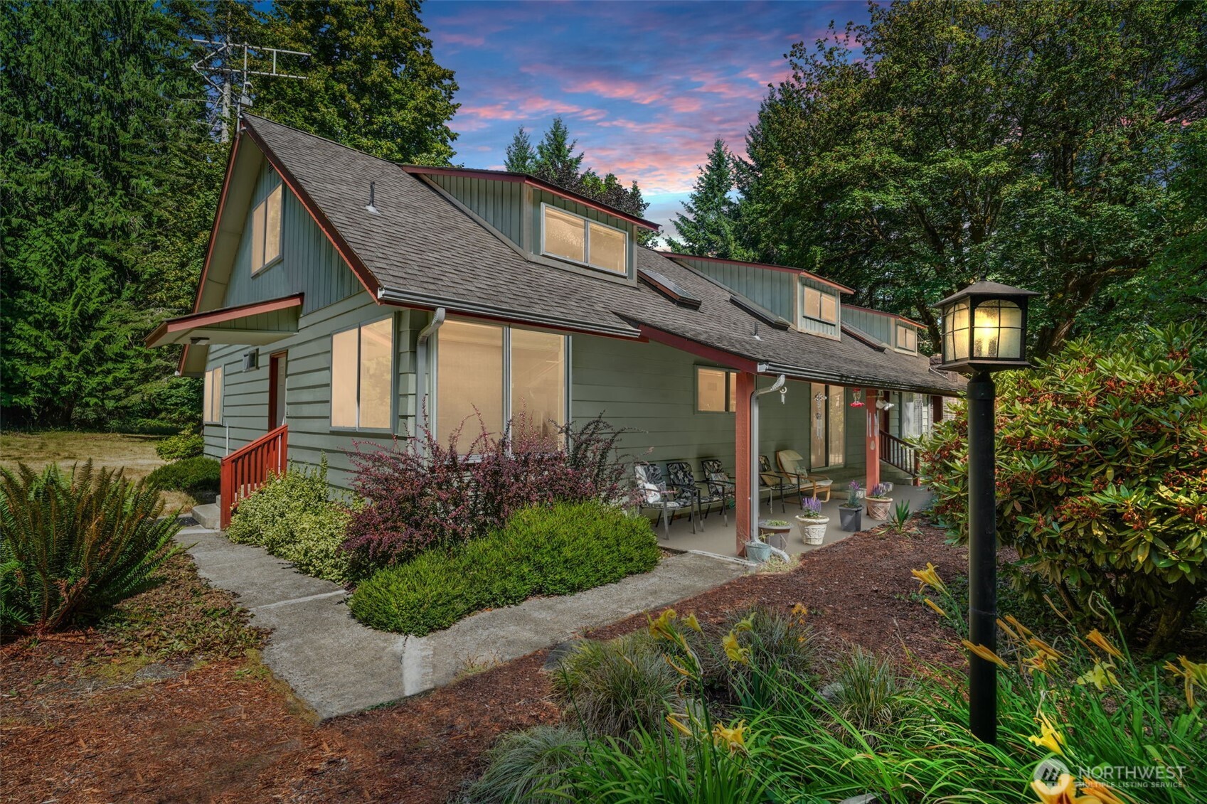 MOTIVATED SELLER. Experience the ultimate in Pacific Northwest living on 25 + private acres. This 5-bed, 2.75-bath, 3,510 sq ft estate blends comfort, functionality, and self-sufficiency. A second kitchen upstairs adds versatility, while the outdoor furnace, 500-gal propane tank, and whole-house generator with interior switch ensure peace of mind in any season. Starlink internet keeps you connected, RV parking offers full hookups, and the deck is wired for a hot tub. Enjoy a fenced garden with greenhouse, plus mature apple & walnut trees—all just minutes from town, yet worlds away from ordinary.