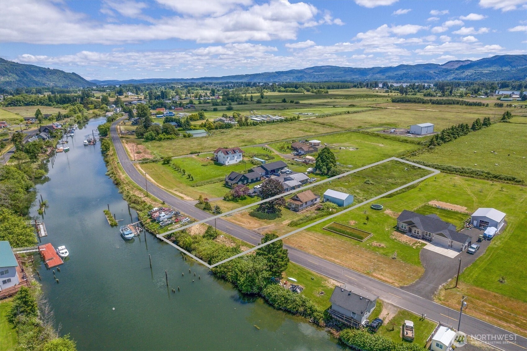 This little fixer sits on 1.25 partially fenced acres with one hundred feet of frontage on Welcome Slough! The mostly level lot has plenty of room for gardening or small scale farming while the waterfront across the road has 2 pilings ready to be put to use. The three bedroom house gives off some definite cottage charm with a sunporch across the front and is ready for you to make it your own. Store your toys close at hand in the 24' x 36' shop with a (mostly) concrete floor and take advantage of the island life on the Columbia River. Just a few minutes to the small town of Cathlamet and only 1.5 hours to PDX. This is an estate and is being sold as-is. Cash offers only. Come check it out!