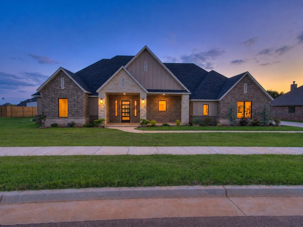 If you've been searching for a home that combines beautiful design with practical everyday living, this one deserves a look. From the oversized garage that will fit your truck and incredible storage to the chef-inspired kitchen and spa-like primary suite, every space has been designed with purpose. The spacious living areas feature durable wood-look tile flooring, while the designer kitchen is sure to impress with premium ZLINE appliances, abundant workspace, and an incredible walk-in pantry complete with built-in microwave, extensive storage, and the refrigerator is included. The flexible split floor plan offers privacy for the primary suite along with two secondary bedrooms connected by a Jack-and-Jill bathroom, plus a fourth bedroom or use it as a study to easily accommodate today's work-from-home lifestyle. Retreat to the luxurious primary suite featuring beautiful wood beam accents, a spa-inspired bathroom with an oversized curbless walk-in shower, and an impressive custom closet filled with built-ins, natural light, and direct access to the walk-through laundry room—a feature you'll quickly wonder how you ever lived without. Step outside to enjoy the expansive covered patio, perfectly positioned for shade all day long. Ideally located just off Sooner Road across from Belmar Golf Club, this home offers an exceptional combination of quality custom construction, functional design, and a convenient location you'll love.