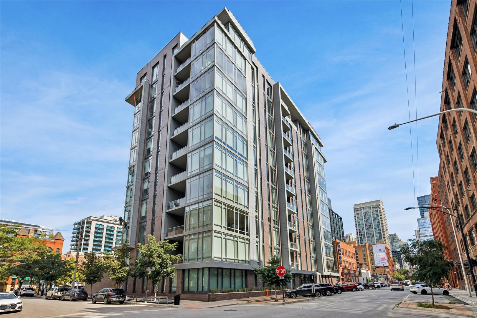 2 GARAGE PARKING SPACES INCLUDED! First high floor corner unit available since building's completion in 2019! This spectacular River North home is situated in one of Chicago's most dynamic neighborhoods. Featuring an expansive layout with two private balconies, this residence features floor-to-ceiling, wall to wall windows offering unobstructed urban views and abundant natural light. Enjoy ten-foot ceilings, hardwood floors, and custom built-ins throughout. The chef-inspired, open kitchen is outfitted with sleek Italian cabinetry, marble countertops, and top-of-the-line Wolf & Bosch appliances-perfect for both everyday living and entertaining.  An impressive primary suite includes two walk-in closets, a private terrace, and a spa-caliber bath for the ultimate retreat. Two additional generously sized bedrooms-one with an ensuite bath-offer versatility and comfort. A full laundry room and exceptional storage complete this exceptional home.