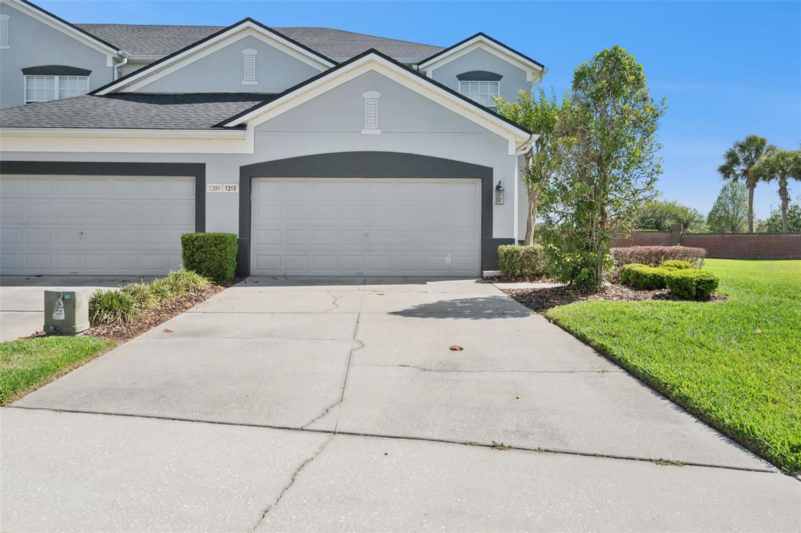 BACK ON THE MARKET!!! Previously TOM.  Looking for BRIGHTNESS, PEACEFULNESS, PRIVACY and WATER VIEW to call HOME? This is IT! In addition to be a CORNER UNIT, it sits on the Guard-gated community of Spring Isle in East Orlando.  The home also offers a blend of COMFORT, FUNCIONALITY and STYLE just minutes from Avalon Park’s Town Center.  A very special feature of TWO MASTER SUITES, one Upstairs and the other Downstairs is ideal for guests or multigenerational living. Enjoy WATER views from the upstairs den, office or study which also includes its own bathroom... HIGH CEILINGS welcome you, and a kitchen with 42-inch cabinets and crown molding, a breakfast bar and a fairly NEW Stainless Steel Refrigerator.  A convenient half bath is nearby too. Other recent renovations include a new roof and exterior paint (2021) covered by the HOA.  Washer and Dryer were purchased in approx. 2023.  This home also features a TWO CAR garage and the opportunity to add a screened-in patio extension beyond the slab (community-approved). Spring Isle offers resort-style amenities with low HOA fees of only $243 a month, which cover the roof, exterior paint and lawn upkeep, making this a LOW MAINTENANCE home. Community amenities include a fully equipped FITNESS CENTER, a sparkling POOL, playground, and a dog park. Residents enjoy access to top-rated local schools and a well-managed HOA in a peaceful, family-friendly environment. Centrally located near Shopping Centers, the University of Central Florida, Valencia College East Campus, Downtown Orlando, and offers easy access to major roadways including 408, 417, and 528 for a convenient commute in any direction.  What are you waiting for? Your NEW OASIS awaits you...