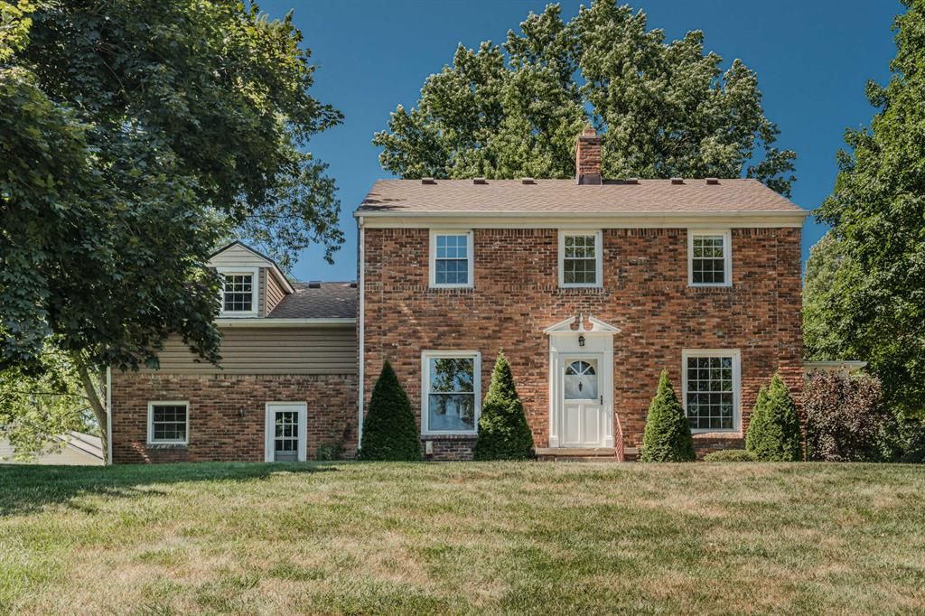 In the most beautiful park-like setting this agent has seen in 30+ years, you'll find this stately brick center-entry colonial with architectural features found in a bygone era.   Upon entry, you'll find a spacious living room with coved ceilings and a doorway to the covered side porch.  There's a cozy kitchen with a bay-window eating space, and a sunken family room.  Upstairs you'll find 3 bedrooms, 2 full (updated) baths , and a bonus room above the family room, w/ample built-in storage.  There are newer windows throughout.  The dry basement has walk-up stairs, and offers a 2nd family room space.  Outside, you'll find a 3-car detached garage, plus two spacious sheds.  Wildlife visits nearly every day, making this home into an oasis of peace within a bustling world.  Don't miss it!
