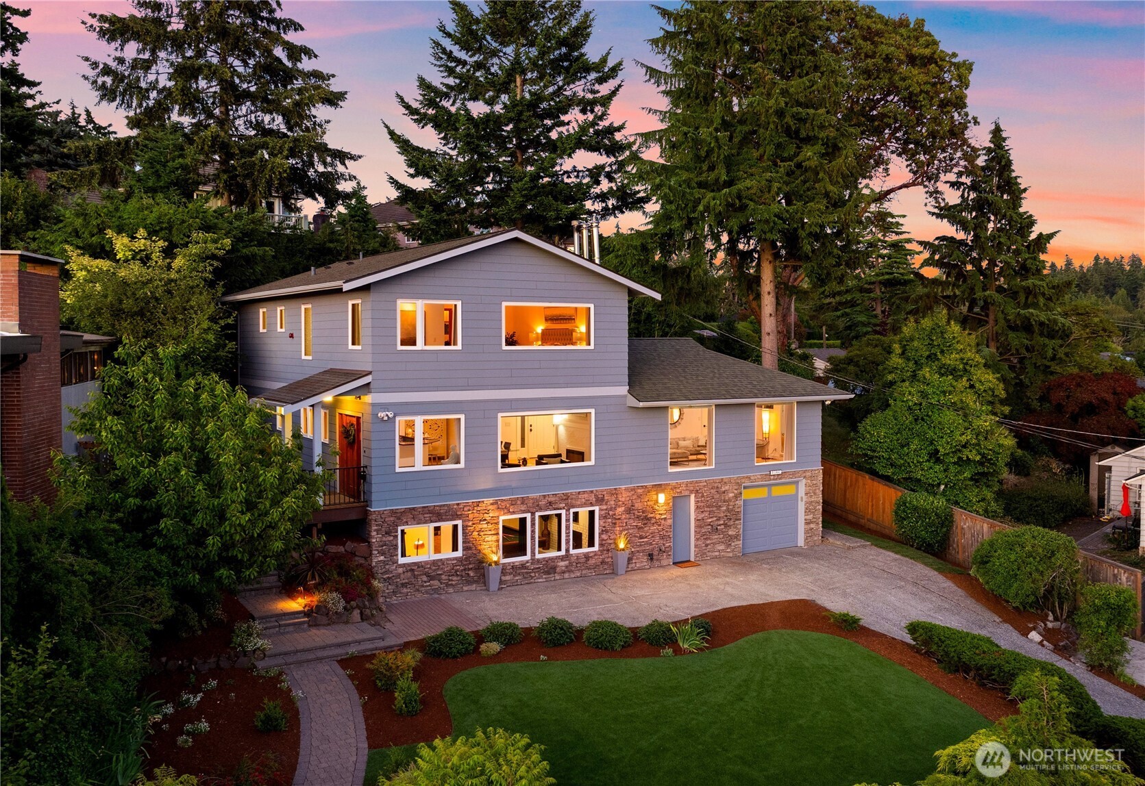 Positioned in sought-after Shorewood on the Sound, this four-bedroom, four-bathroom estate captures sweeping Puget Sound and Olympic Mountain views from all three levels. Walls of windows frame the water and mountains throughout the home, creating a front-row seat to changing skies, shimmering water, and Olympic alpenglow from morning through evening. Inside, hardwood floors and a thoughtful floor plan keep the views at the center of daily life. The kitchen features a professional gas range, stainless steel appliances, quartz counters, and dark penny tile backsplash, flowing into the media room and out to the patio for effortless indoor-outdoor living. Generous living and dining spaces set the stage for gathering, while a dedicated billiards room adds another layer to the home's entertaining spaces. Upstairs, the primary suite is a true retreat with panoramic Sound and Olympic Mountain views, a custom walk-in closet, and a bath with wood dual vanity and glass-enclosed shower with mosaic tile underfoot. Outside, nearly a third of an acre of manicured grounds offers multiple patios for dining and gathering, all complemented by the surrounding water and mountain vistas. Just moments away, private Puget Sound beach access opens to low-tide walks, salt air, and quiet shoreline mornings. **Ask about a lender-paid 2-1 interest rate buydown through preferred lender, offering a 2% lower interest rate for the first 12 months and 1% lower for the following 12 months.