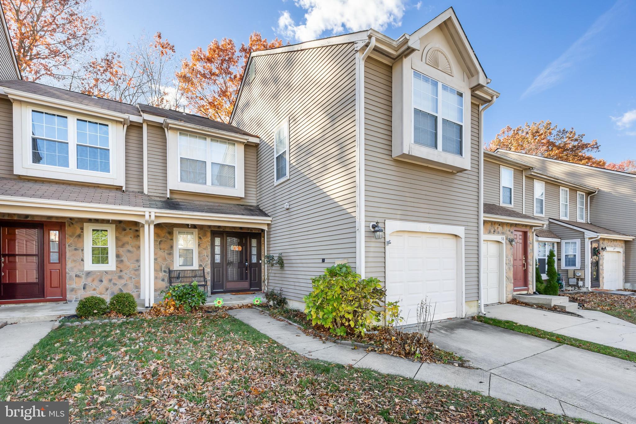 Wow!  $20,000 price reduction AND brand new carpeting on the staircase and entire second floor!  Welcome to 60 Kettlebrook Drive, located in the desirable community of The Lakes in Mount Laurel! This beautifully maintained 3-bedroom, 2.5-bath townhome offers a perfect blend of comfort, style, and convenience. Step inside to find luxury vinyl flooring throughout the first floor and a bright, open layout. The two-story family room creates a dramatic and inviting space, complete with a wood-burning fireplace for cozy evenings. The kitchen features granite countertops and a functional layout, perfect for cooking and entertaining. Upstairs, the spacious primary suite includes a private ensuite bathroom and ample closet space. Major updates include a new HVAC system installed in 2024, and a hot water heater and refrigerator approximately 3 years old. Enjoy peaceful mornings or unwind at the end of the day on your patio overlooking the woods, offering beautiful natural views and privacy. Conveniently located near major highways, shopping, dining, and parks—this is the ideal place to call home!