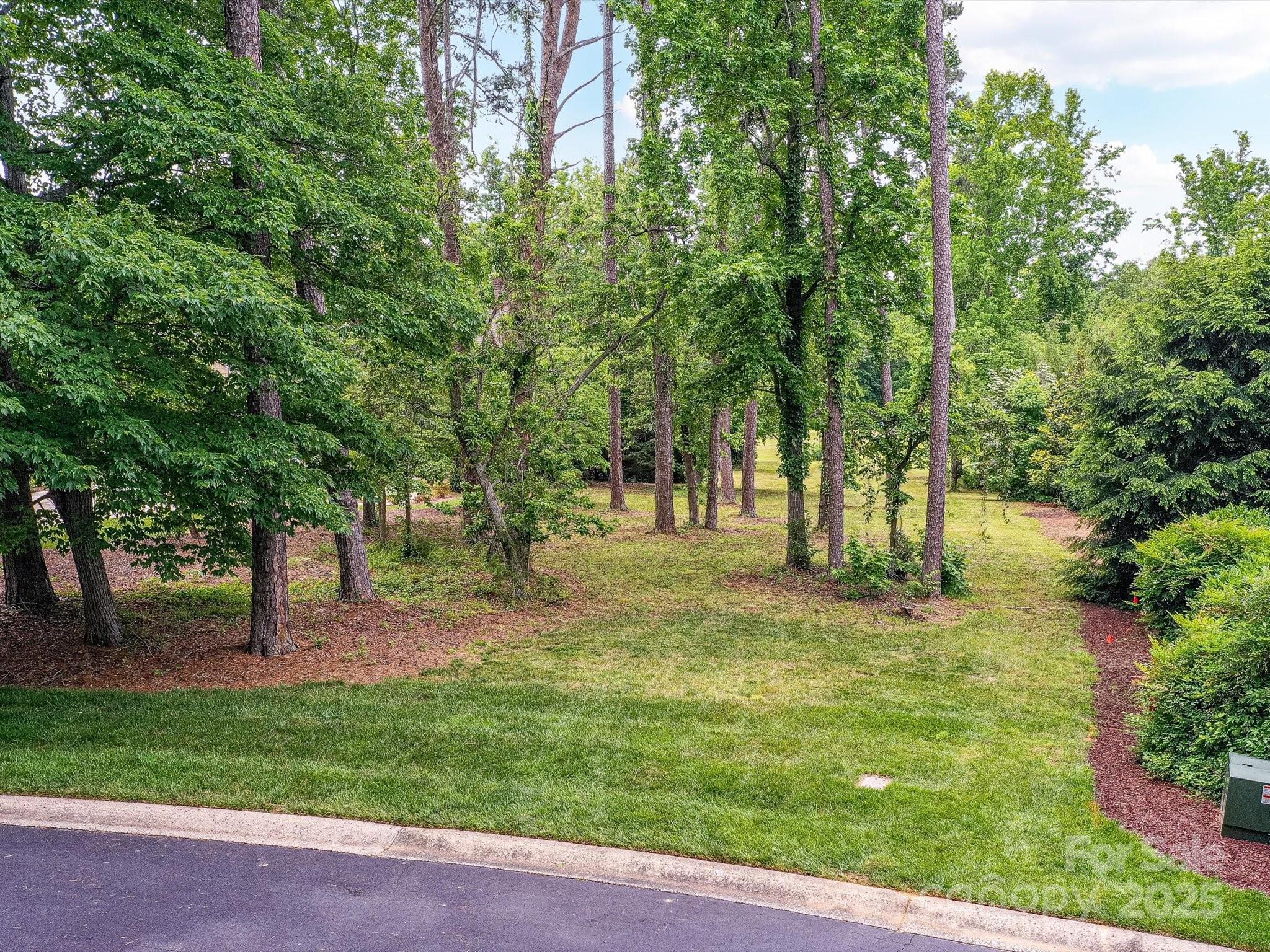 Welcome to the Uwharrie Point community! Beautiful flat lot located on the Tom Fazio designed Championship golf course, with views of Badin Lake from the back of the lot. The community is a gated with 24 hour security so you'll enjoy all of the amenities the community has to offer including a Marina, clubhouse, tennis courts, pickleball, pools, putting greens, and walking trials whenever you would like peacefully! The Old North State Golf Club opportunities do require membership. For the nature enthusiast, the Uwharrie National Forest is only minutes away and is a great place for many many kinds of outdoor activities. A short commute from Charlotte or Greensboro makes this a wonderful place to build your dream home or vacation get away!!