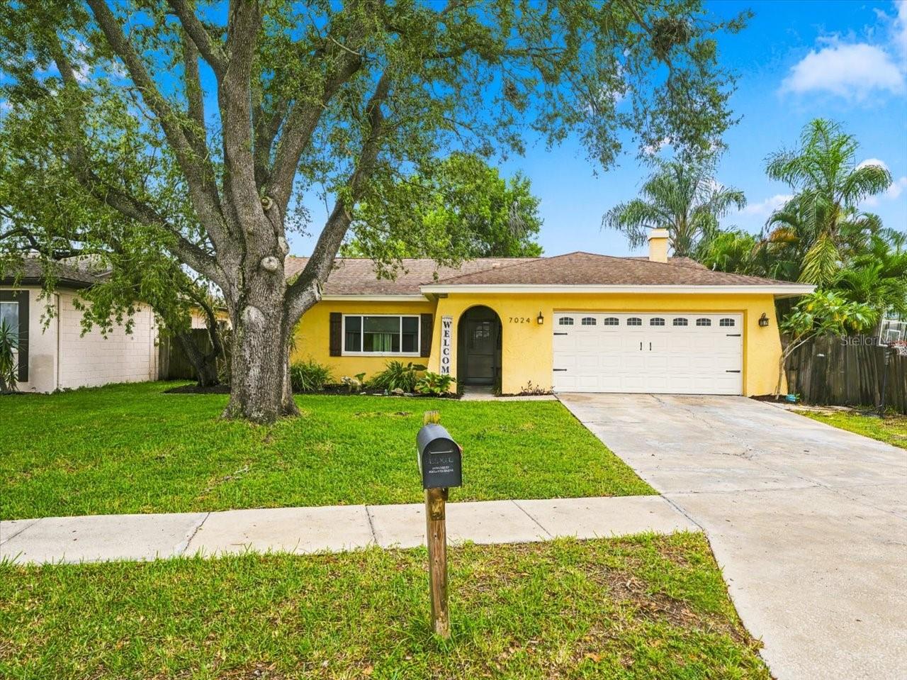Under contract-accepting backup offers. Prepare to be impressed with this beautiful inside and out, beautifully updated home located in the desirable Pinebrook Estates neighborhood! Rare opportunity to purchase this sought-after home that is HIGH AND DRY and NOT IN A FLOOD ZONE, offering peace of mind along with a beautiful, peaceful pond setting. Featuring 3 Bedrooms, 2 bathrooms, open living spaces with dining and a living room, plus a bonus family room, this home has been thoughtfully updated!The moment you walk through the front door you will appreciate the open floor plan, beautiful finishes and peaceful views of the pond. The heart of the home centers around the gorgeous updated kitchen featuring custom cabinetry, granite countertops, an oversized granite island, newer appliances, pull-out pantry shelving and a premium tile backsplash added in 2025. The spacious living area features a custom wood fireplace mantle added in 2020, creating the perfect space for relaxing or entertaining.The generously sized bedrooms offer plenty of space and storage with two very large walk-in closets, while the primary bedroom features his and hers closets! Both bathrooms have been beautifully remodeled and offer a fresh, updated feel.Step outside and embrace the TRUE FLORIDA LIFESTYLE! You will love relaxing on the large screened lanai overlooking the beautiful, peaceful pond. Whether enjoying your morning coffee, entertaining friends and family or winding down at the end of the day, this is the perfect place to enjoy the sounds of nature and the tranquility of your own backyard. The beautifully landscaped backyard also features 2 sheds for additional storage and plenty of room to enjoy the Florida sunshine.Too many upgrades to list but some include 2018 New Roof, 2022 New HVAC System, 2019 New LVP Flooring in Primary and Guest Bedrooms, 2025 Premium Kitchen Backsplash, 2020 Custom Wood Fireplace Mantle, remodeled bathrooms, energy-efficient windows, LED lighting and ceiling fans. The 2-car garage offers incredible storage with 2 overhead storage racks, utility sink and large attic with decking. The home also includes custom-cut and drilled hurricane window board covers with anchor bolts permanently attached to the structure.You can't beat this location! Walking distance to Pinebrook Park featuring a playground and active pickleball courts, perfect for enjoying the outdoors, staying active and becoming part of this wonderful neighborhood. Conveniently located near shopping, restaurants, major roadways, schools and so much more! A short drive to the beautiful Gulf beaches and Tampa International Airport. HIGH AND DRY, NOT IN A FLOOD ZONE! Schedule today as this one will not last!
