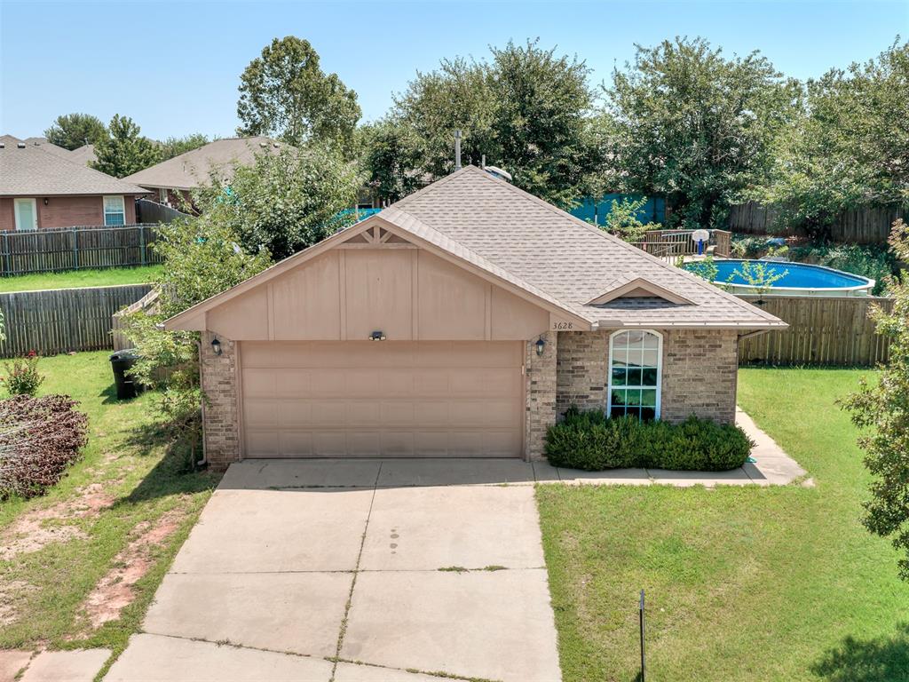 Welcome home to this 3-bedroom, 2-bathroom home that offers the perfect blend of comfort, style, and outdoor living. From the moment you step inside, you'll appreciate the warm wood floors that flow through the spacious living room, creating an inviting space to relax or entertain.The updated kitchen is sure to impress with its gorgeous granite countertops, beautiful new cabinetry, and plenty of workspace for preparing meals or gathering with family and friends. Whether you're hosting the holidays or enjoying a quiet evening at home, this kitchen is designed to be the heart of the home.The primary suite offers a comfortable retreat, while the additional bedrooms provide flexibility for family, guests, or a home office.Step outside and discover your own backyard oasis! Cool off on warm Oklahoma days in the above-ground pool, then unwind under the charming tiki hut with your favorite drink. It's the perfect setting for weekend barbecues, summer parties, or simply relaxing after a long day. The fully fenced backyard provides plenty of room for pets, play, and outdoor entertaining.A two-car garage offers ample space for parking and storage, while the home's thoughtful updates make it truly move-in ready.If you've been searching for a home that combines modern updates, functional living spaces, and a backyard designed for making memories, this is one you won't want to miss. Schedule your private showing today and see everything this wonderful home has to offer!
