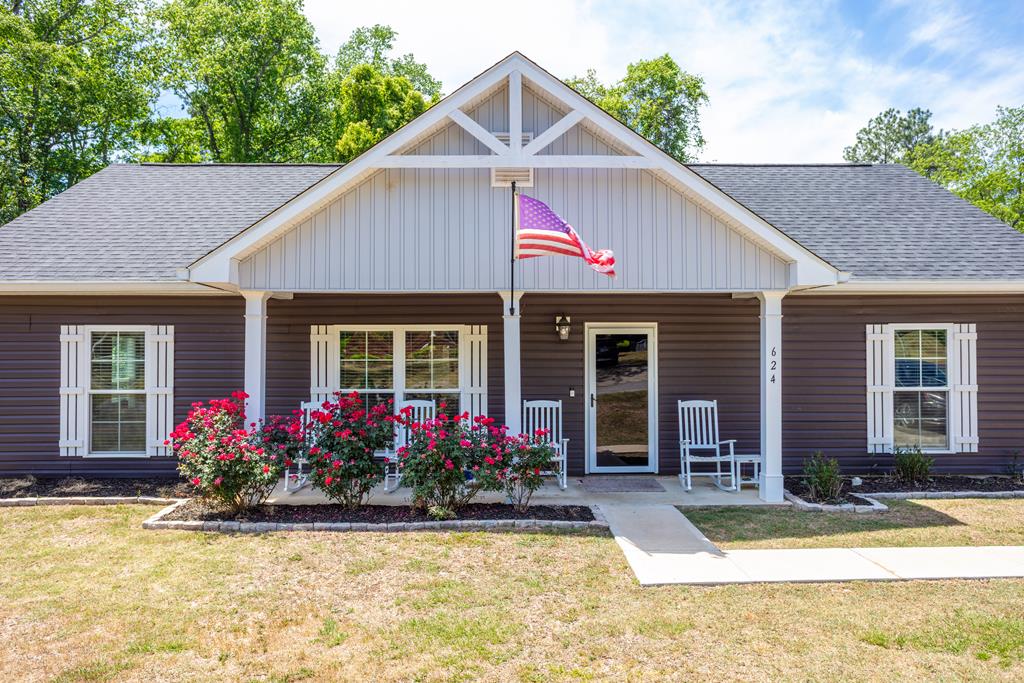 Like new craftsman cottage, move in ready! This immaculate 1,500 sq. ft. home, just blocks from Downtown was built in 2021and gently lived in. Split floor plan with large primary suite with walk in closets, on one end of the house with two additional spacious bedrooms and walk in closets on the other end of the house. Spacious open floor plan with a large living space and kitchen featuring luxurious granite countertops, beautiful custom cabinetry and stainless steel appliances.  Large laundry room with plenty of storage. Upgraded fixtures in additiaon to recessed  lightning . High ceilings with plantation blinds and a beautiful muted color palette throughout. High quality LVP flooring, all on one level makes this home perfect for mobility aids and safety. Outside, find a beautifully manicured lawn surrounded by natural wooded landscape on 0.64  which you can enjoy from a cozy screened back porch. Find the detached storage building for all of your tools and treasures! Call today for an appointment to see this charming home!
