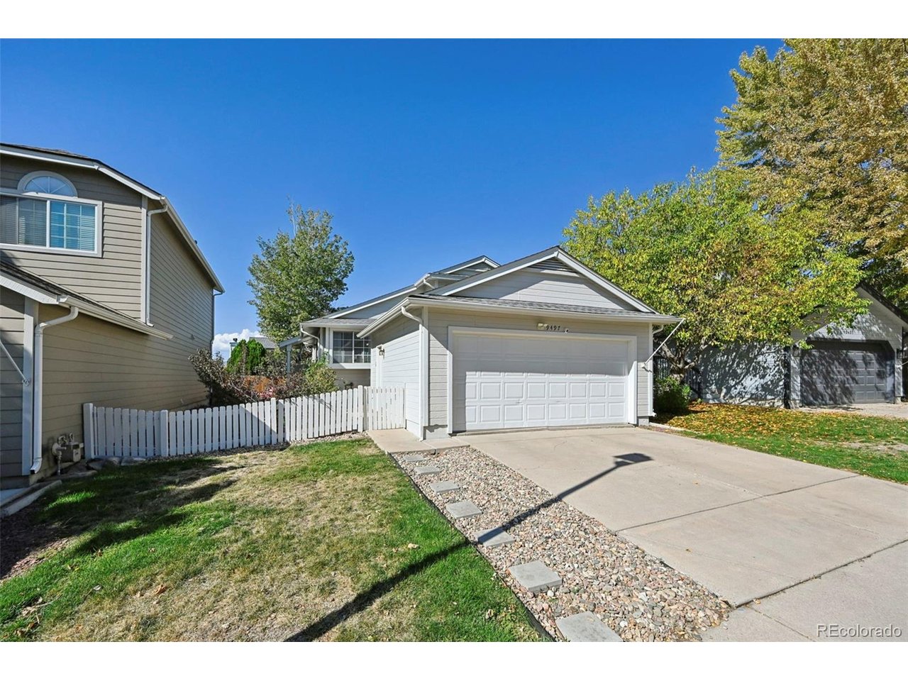 Step inside this beautifully refreshed home, filled with natural light, neutral colors, and inviting spaces! The open living room features vaulted ceilings, a skylight, and brand-new luxury vinyl plank flooring, fresh paint, updated baseboards, and modern door hardware. The remodeled eat-in kitchen shines with granite countertops, freshly painted white cabinetry, brand-new stainless steel appliances arriving soon, and durable vinyl plank flooring, all overlooking the welcoming family room. Step outside to a large, expansive concrete patio-perfect for entertaining, summer BBQs, and outdoor gatherings. Upstairs, you'll find a spacious primary bedroom, a second bedroom, and a full bathroom, with fresh paint and new carpet throughout. The lower level offers even more living space, featuring a cozy family room with a charming fireplace, a 3/4 bathroom, and an additional bedroom. Need extra storage? Enjoy the bonus of a spacious crawl space! Major updates include a newer roof, furnace, A/C, and tankless water heater, offering added peace of mind. With its fresh updates, versatile living spaces, and inviting curb appeal, this home has so much to offer! Plus, enjoy the fantastic HR amenities, including a community pool, parks, trails, and fitness center. Don't miss the opportunity to make this beautiful home yours!