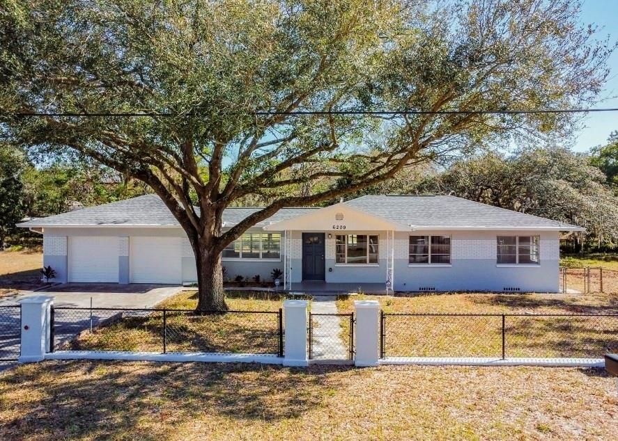 Rare Tampa Opportunity on Five Lots. Enjoy the space and flexibility of five lots totaling approximately 35,000 square feet (0.80 acre), with a renovated 3-bedroom, 2-bath home and a 2-car garage. Inside, you’ll find new flooring throughout, updated ceiling fixtures, and a refreshed kitchen with new cabinets, granite countertops, and stainless-steel appliances. The property also features a brand-new well, and the septic system and plumbing serviced 2022, roof, A/C and hot water heater replaced in 2023.The property is zoned RSC-9 (Residential, Single-Family Conventional). Its five-lot layout and generous land area offer room to explore future possibilities, subject to county requirements and approvals. Conveniently located near shopping, gyms, I-275, I-4, Busch Gardens, and Moffitt Cancer Center. No HOA or CDD fees.  Buyers should verify lot boundaries, zoning, permitted uses, and development potential with Hillsborough County