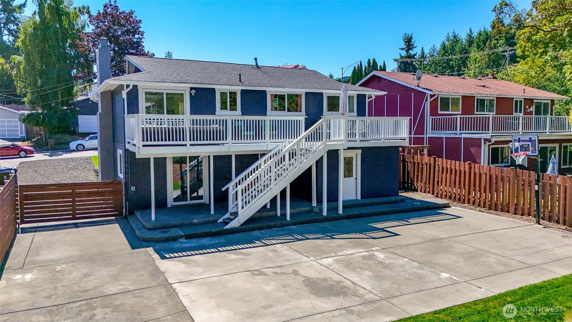 Welcome to this beautifully updated 4-bedroom, 2-bath home offering 1,788 sq. ft. of light and bright living space. Recently refreshed with new paint inside and out, updated vanities, countertops, and modern appliances. The fully fenced yard provides plenty of privacy and versatility with two driveways—one ideal for RV or boat parking with partial hookups. Out back, you’ll love the sport court, perfect for pickleball or basketball, plus a spacious deck overlooking the peaceful greenbelt. Located just minutes from Point Defiance Park and Zoo, 5-Mile Drive, walking trails, and the dog park, this home sits in a friendly community with endless opportunities for outdoor recreation!