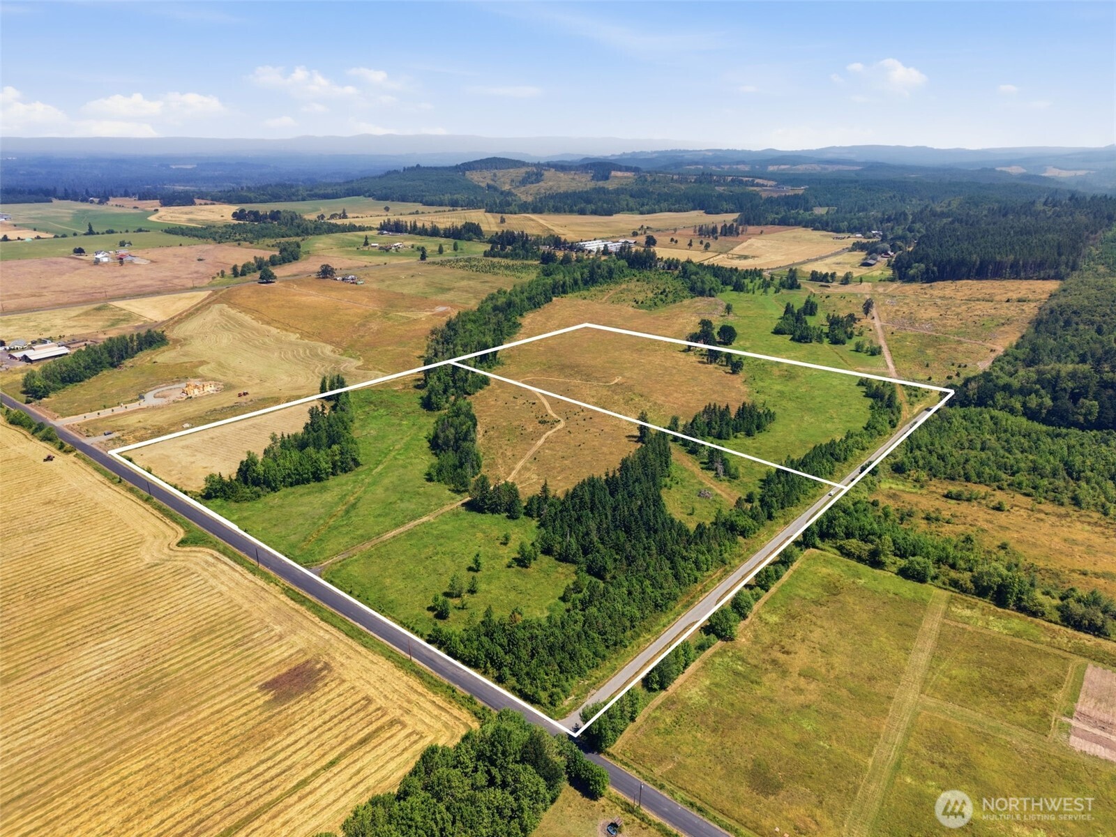 Escape to 44.76 acres of scenic countryside where breathtaking views, peaceful surroundings, and abundant wildlife create the perfect setting for your dream home or getaway. Watch elk and deer roam while enjoying spectacular sunsets from your own property. Wetland delineation and perc test have been completed, with power and fiber communication available at the property corner. Conveniently located near the Cowlitz River, parks, and endless outdoor recreation, this property offers quick access to I-5 and is ideally situated between Seattle and Portland. Buyer to verify all information to their own satisfaction.