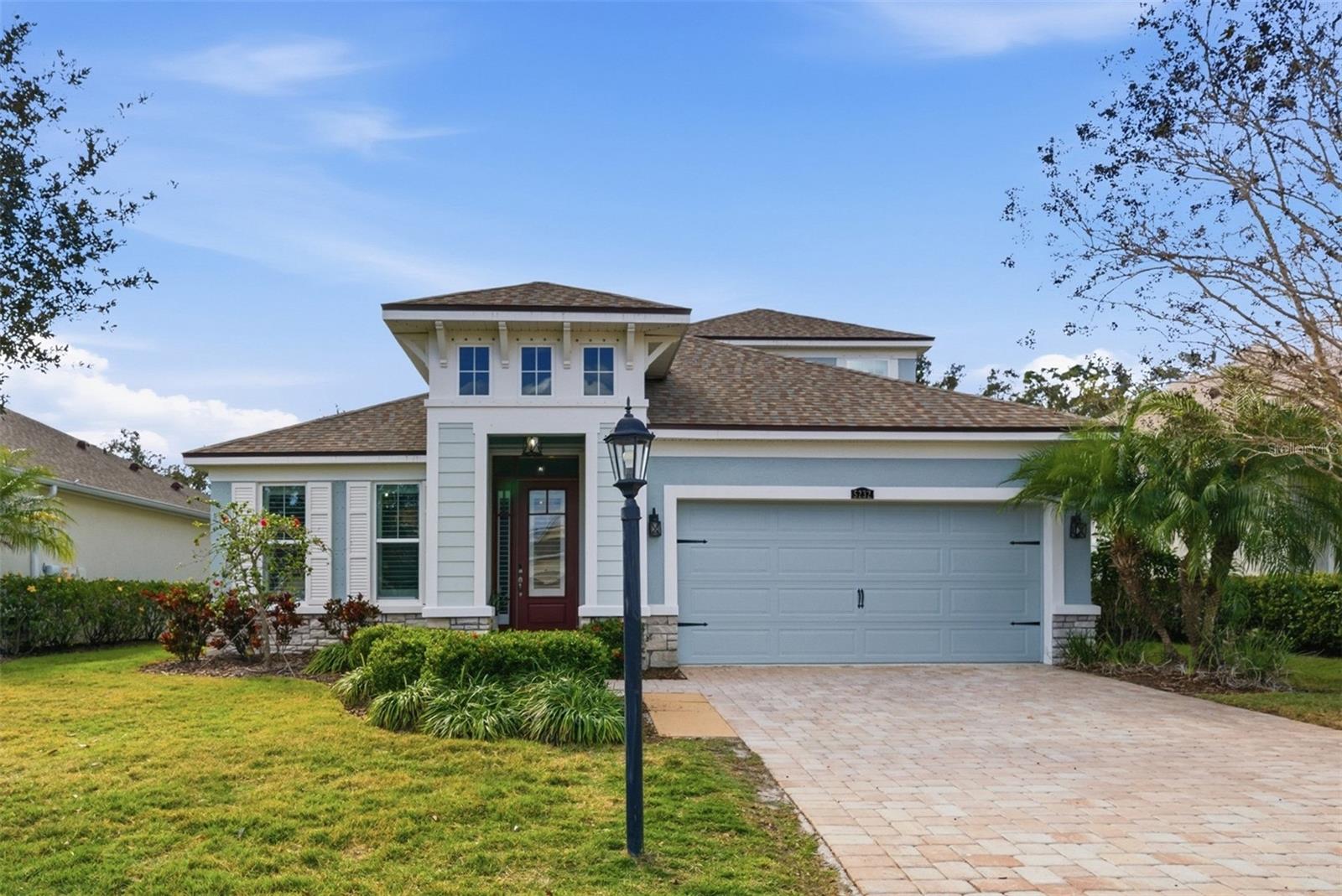 Welcome to this beautifully updated home in the highly sought-after Harmony community of Lakewood Ranch. Built in 2016 and thoughtfully upgraded, this 4-bedroom, 3-bath residence offers 2,470 square feet of open-concept living, including a dedicated office or dining space, an upstairs loft, and a private backyard oasis with a heated pool and spa.The heart of the home is the custom-designed kitchen, fully renovated in 2024, featuring quartz countertops, designer lighting, updated cabinetry, and a spacious island that opens seamlessly to the dining and family rooms—ideal for both everyday living and entertaining. Throughout the home, you’ll find 10-foot ceilings, plantation shutters on every window, tile flooring in the main living areas, and luxury vinyl plank flooring in all bedrooms (installed in 2020).