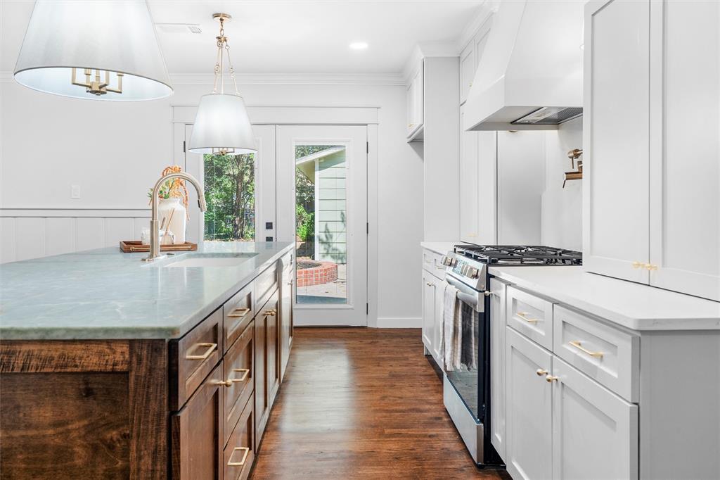 This charming 1940s home has been completely remodeled with all new modern amenities to complement the restored original hardwood flooring and front door. Everything is NEW — foundation, electrical, plumbing, windows, water heater, appliances, interior and exterior paint, cabinetry, countertops, and designer lighting, tile work, and moulding throughout. Outside, you’ll enjoy an oversized detached two-car garage, perfect for storage or a workshop. Conveniently located near Sylvania Park, the Historic Stockyards, downtown Fort Worth, and all major highways. Schedule your showing today and make this beautiful house your new home!