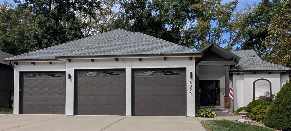 This is your chance to live the lake life in this custom built second tier home in Weatherby Lake.  Located in a newer area of homes, Westridge at Weatherby Lake, this is your opportunity to own a well maintained and energy efficient home with main level living. Surrounded by common areas/woods on two sides, you will be able to experience both lake living and living with nature. Both the main and lower level have large windows overlooking woods, providing  great natural lighting. Enter through the solid Mahogany front door to a foyer and vaulted living room, which features a floor to ceiling fireplace. The dining and kitchen areas are extra large, featuring custom Maple cabinets and tiled flooring.   You will appreciate the dedicated office area off of the dining room, through the custom Shoji doors. Off of the kitchen is a full bathroom along with the laundry room.  Sleep in comfort in the large primary bedroom, large enough to accommodate extra furniture, along with an oversized walk-in closet.  Be ready to relax on the lower level which besides a family room, which also has 3 additional bedrooms, each with their own walk in closet, and two full bathrooms. Many of the rooms have been freshly painted, and you will not find another home with hard scraped solid acacia floors on the main level. Maintenance has been completed on this home, with new roof, exterior paint and new gutters installed in 2025. The lake offers all kinds of outdoor activities, from fishing, swimming, kayaking, paddle boarding, boating to clubs for all ages.  Join the relaxing and friendly atmosphere of Weatherby as you enjoy your new home